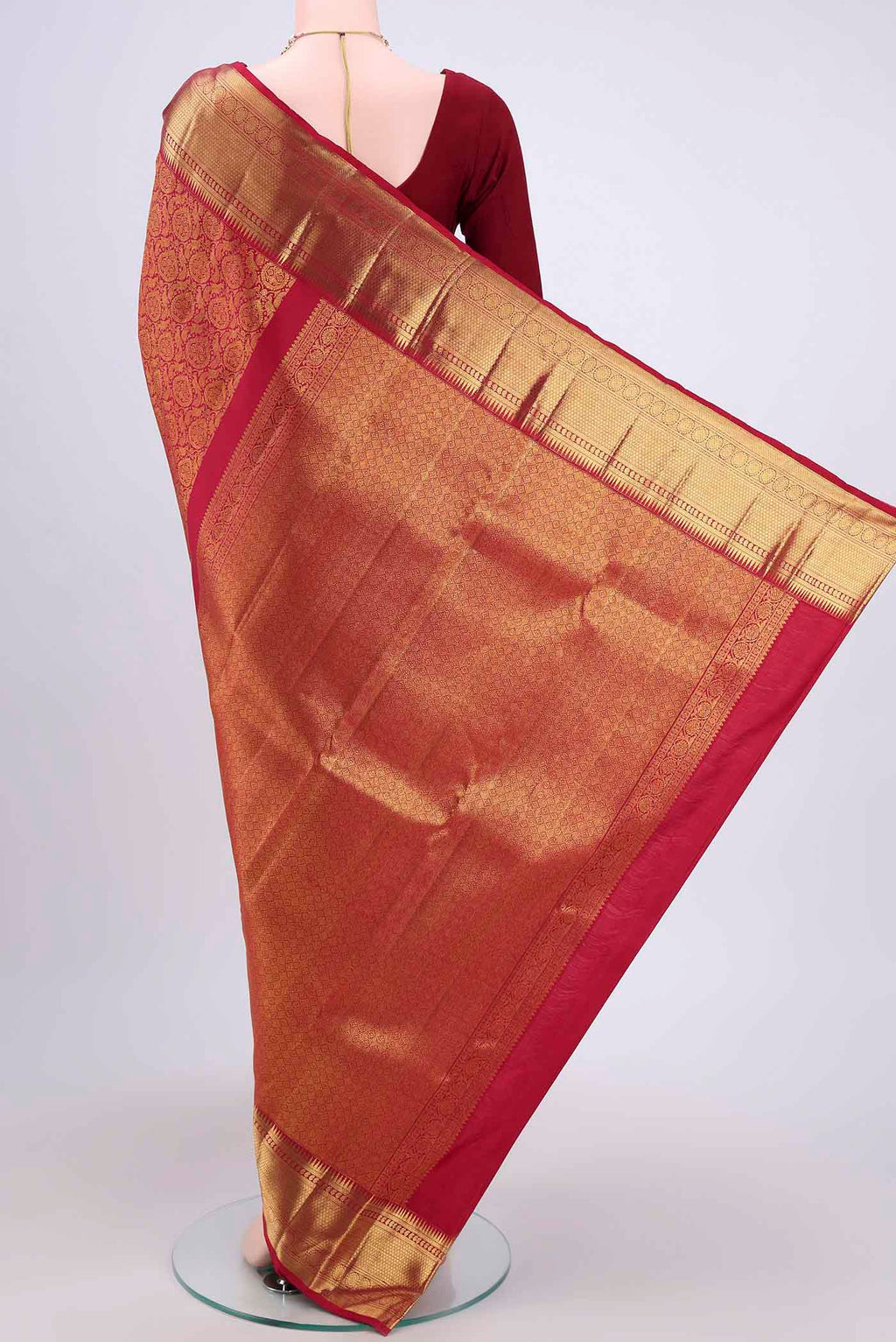 Flat view of Maroon Kanchipuram Saree with Zari Brocade on the body and Zari Border. 