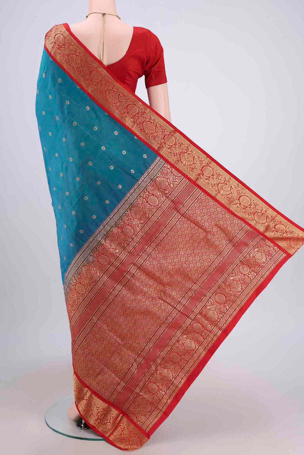 Flat view of Blue Dual Tone Blended Bangalore Silk Saree with Zari Butta on the body and Zari Border. 