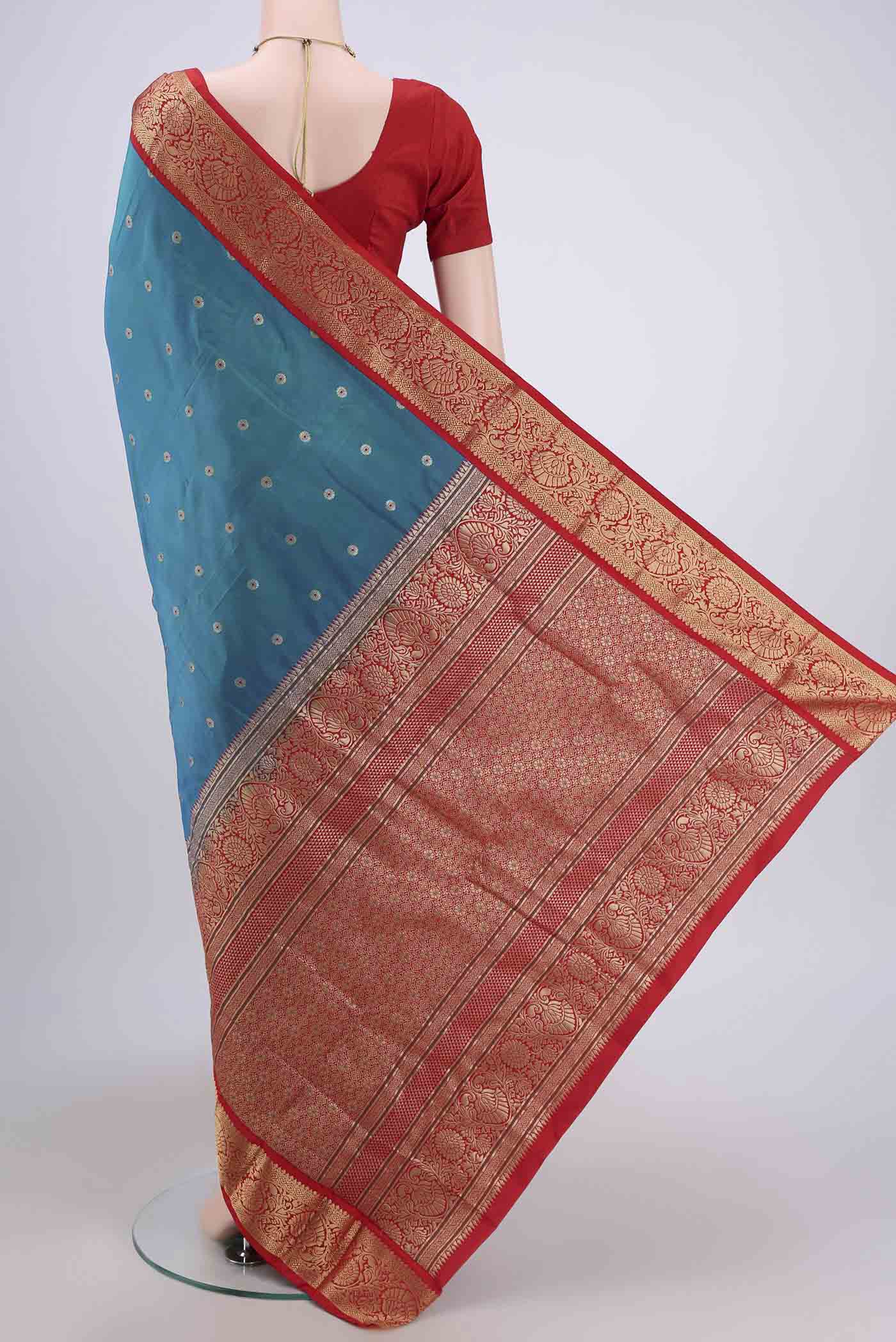 Flat view of Blue Dual Tone Blended Bangalore Silk Saree with Zari Butta on the body and Zari Border. 