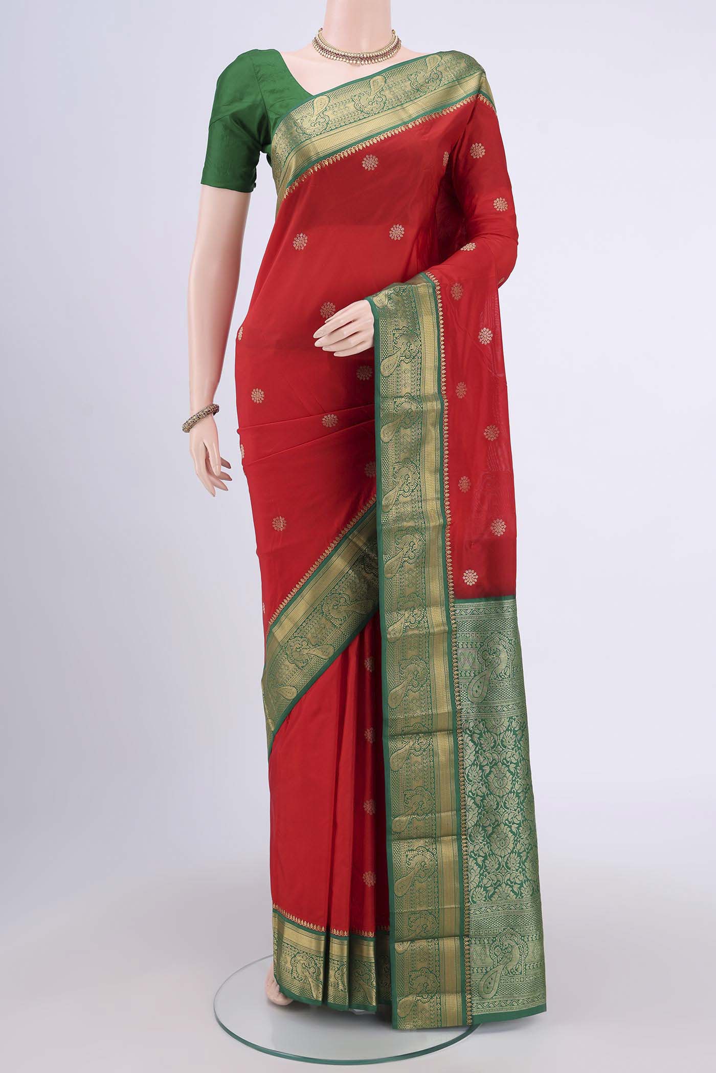 Red Blended Bangalore Silk Saree with Zari Butta on the body and Zari Border.  displayed on a mannequin