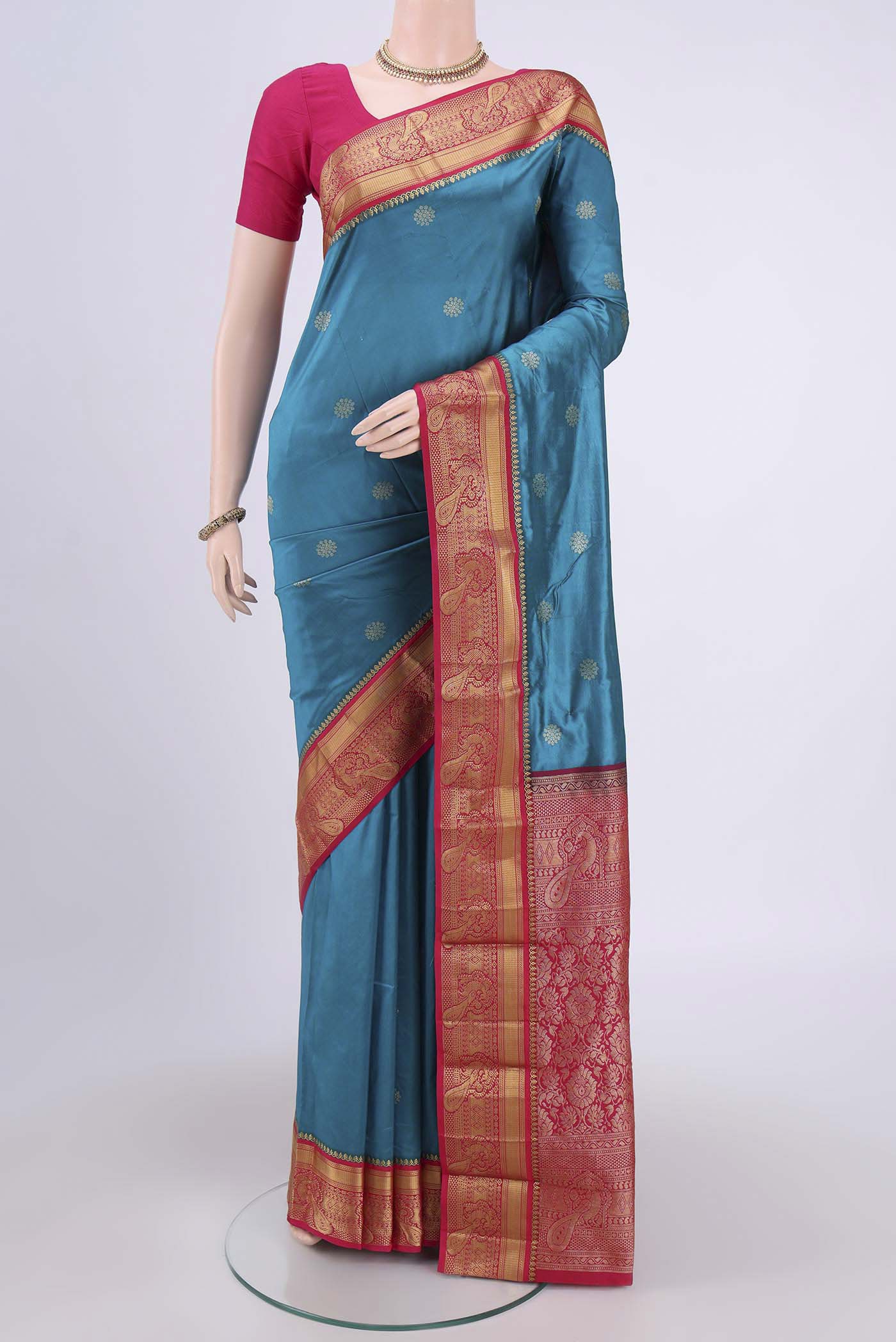 Blue Blended Bangalore Silk Saree with Zari Butta on the body and Zari Border.  displayed on a mannequin