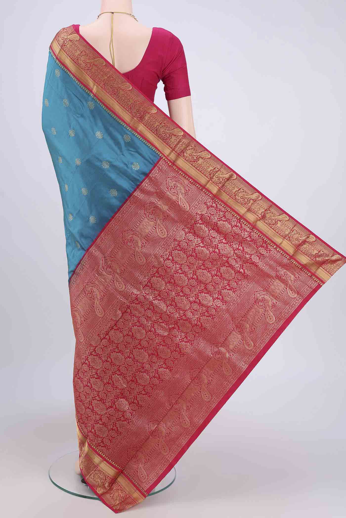 Flat view of Blue Blended Bangalore Silk Saree with Zari Butta on the body and Zari Border. 