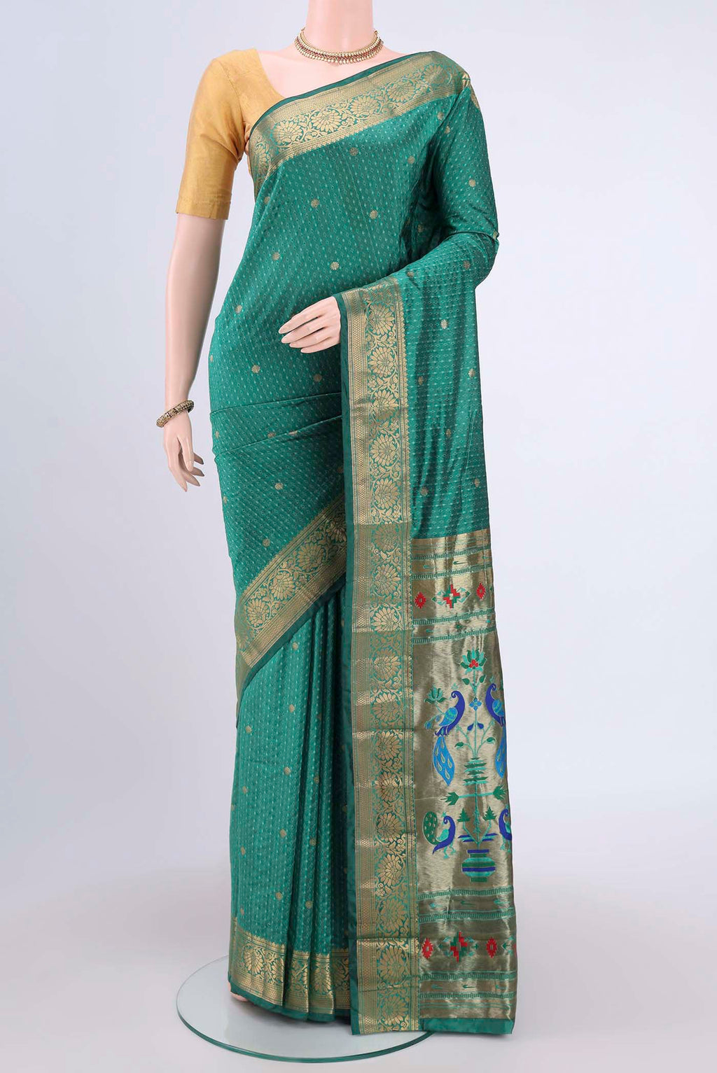 Sea Green Blended Bangalore Silk Saree with Jacquard With Zari Butta on the body and Zari Border.  displayed on a mannequin