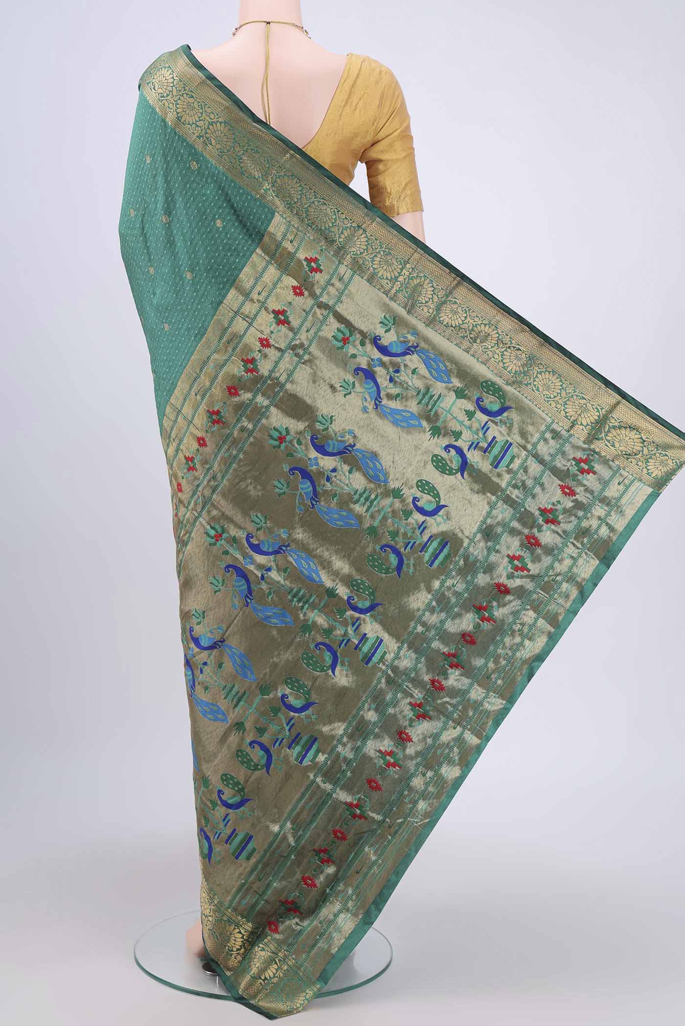 Flat view of Sea Green Blended Bangalore Silk Saree with Jacquard With Zari Butta on the body and Zari Border. 