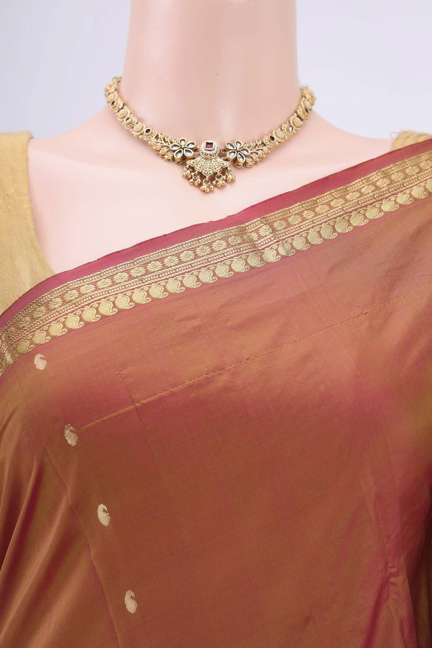 Border image of Brick Orange Dual Tone Blended Bangalore Silk Saree with Zari Butta on the body and Zari Border. 