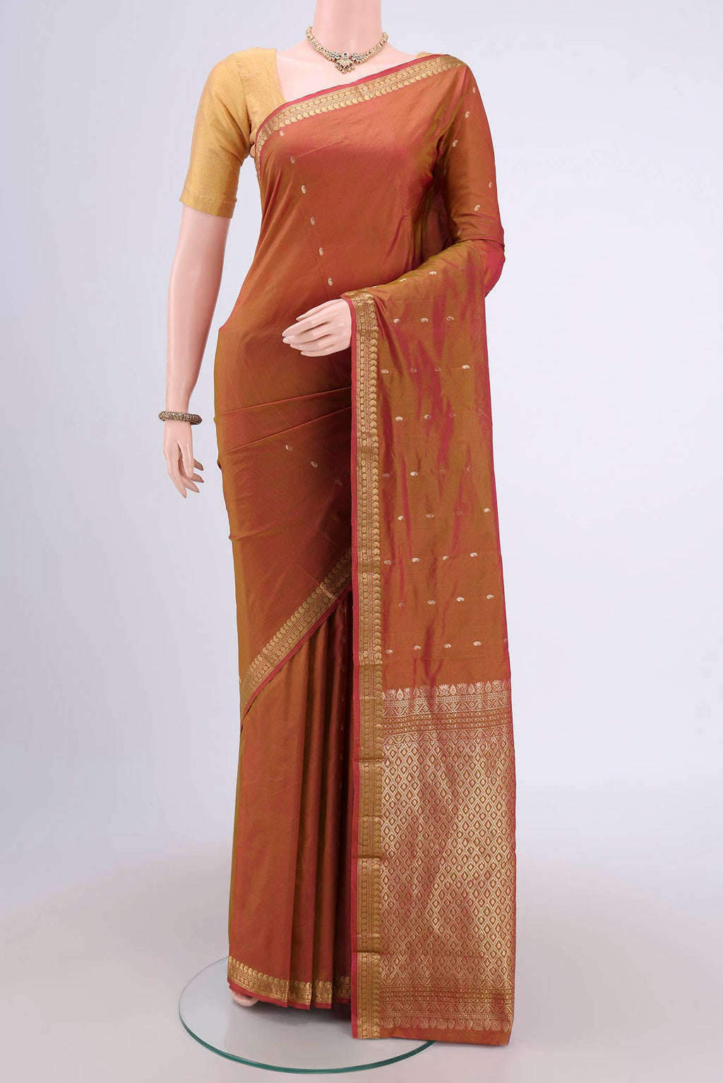 Brick Orange Dual Tone Blended Bangalore Silk Saree with Zari Butta on the body and Zari Border.  displayed on a mannequin
