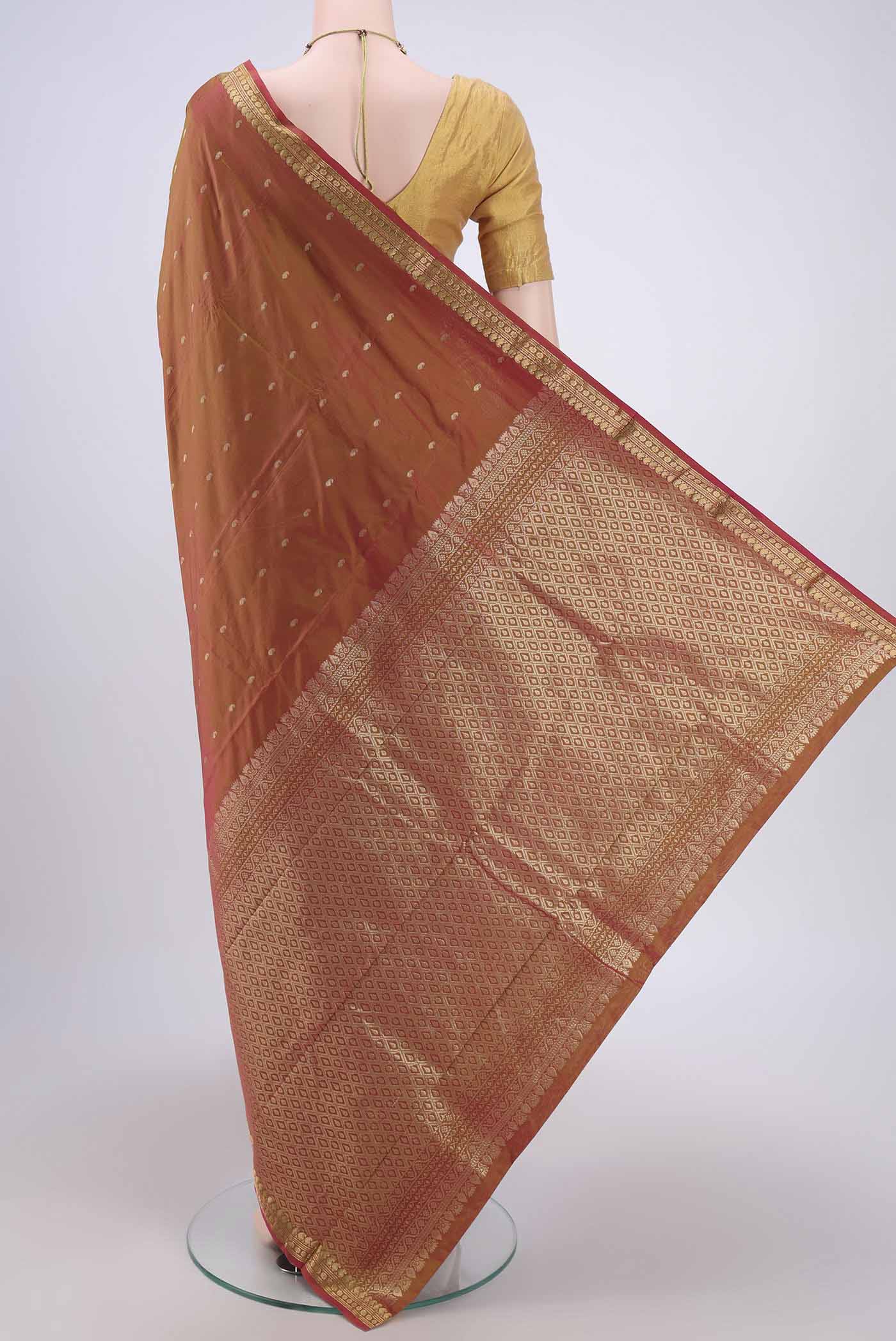 Flat view of Brick Orange Dual Tone Blended Bangalore Silk Saree with Zari Butta on the body and Zari Border. 