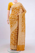Mustard Banarasi Georgette Saree with Zari Brocade on the body and Zari Border.  displayed on a mannequin