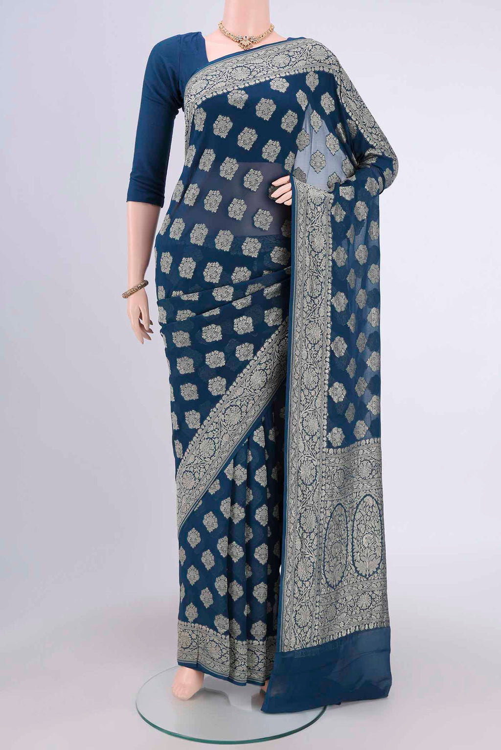 Blue Banarasi Georgette Saree with Zari Brocade on the body and Zari Border.  displayed on a mannequin