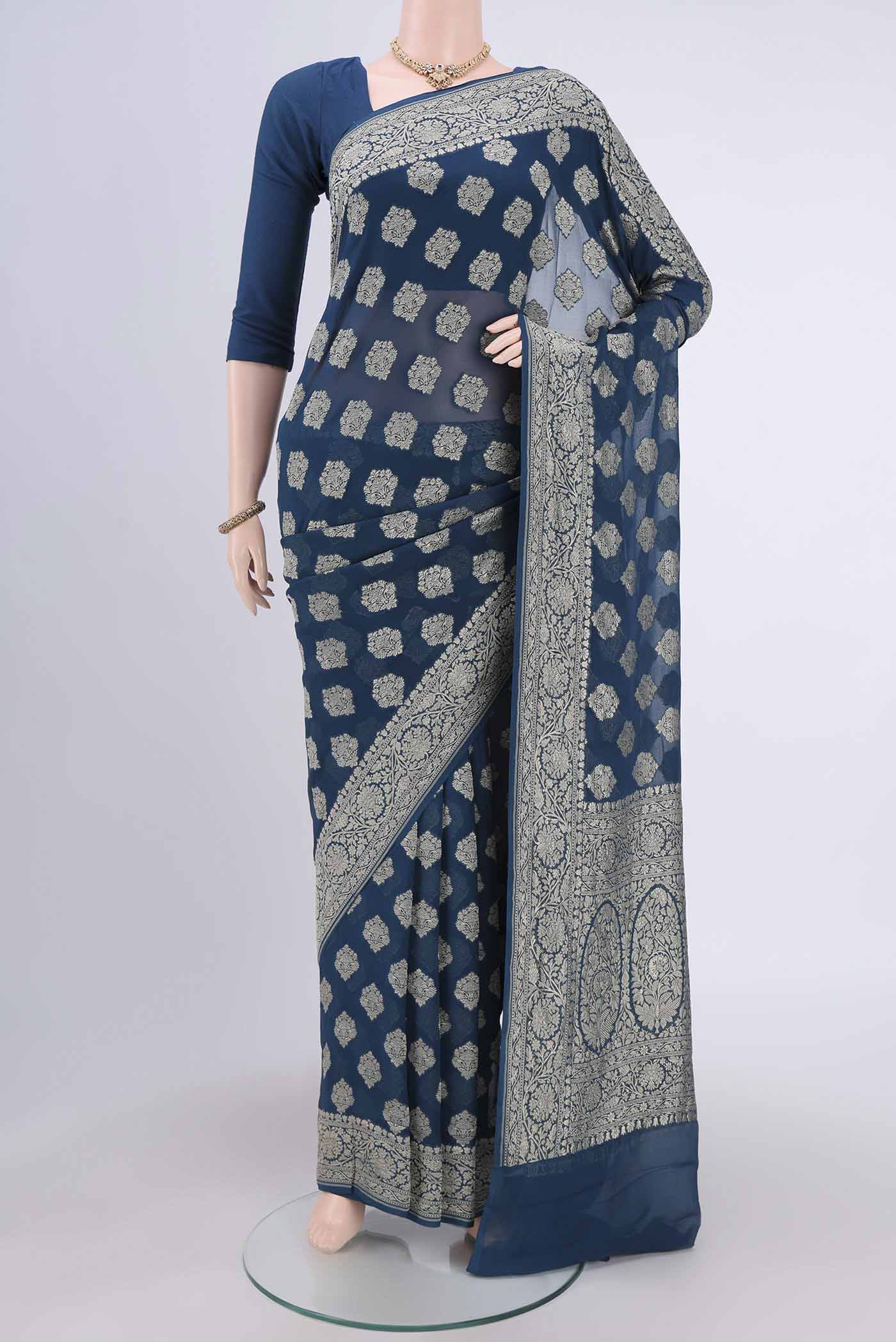 Blue Banarasi Georgette Saree with Zari Brocade on the body and Zari Border.  displayed on a mannequin