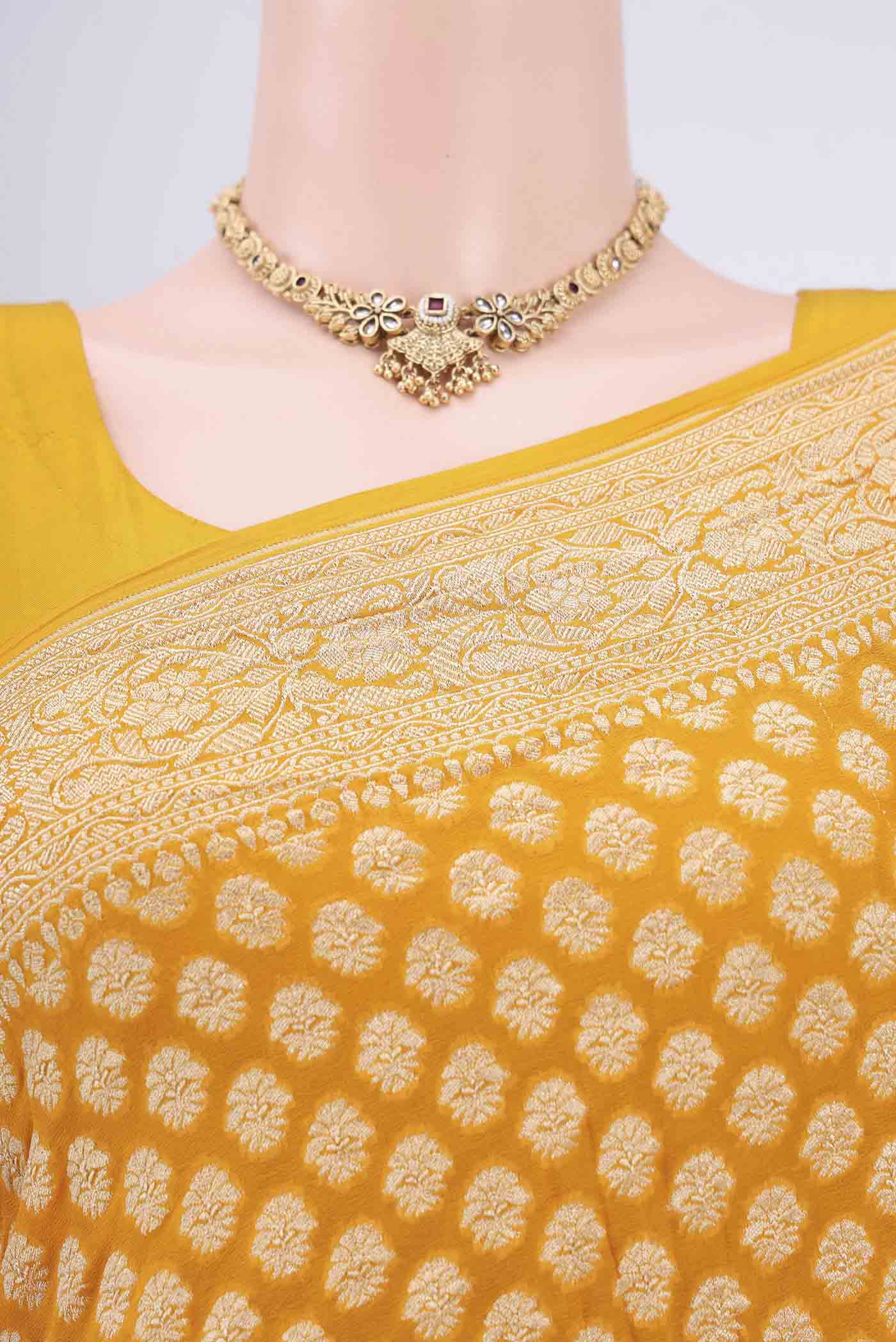 Border image of Yellow Banarasi Georgette Saree with Zari Brocade on the body and Zari Border. 