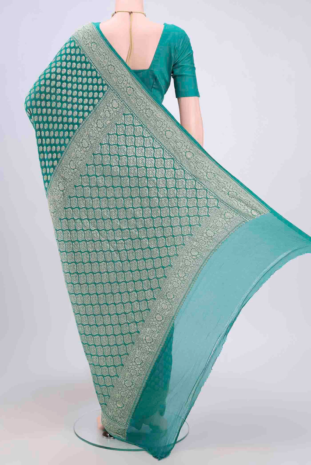 Flat view of Sea Green Banarasi Georgette Saree with Zari Brocade on the body and Zari Border. 