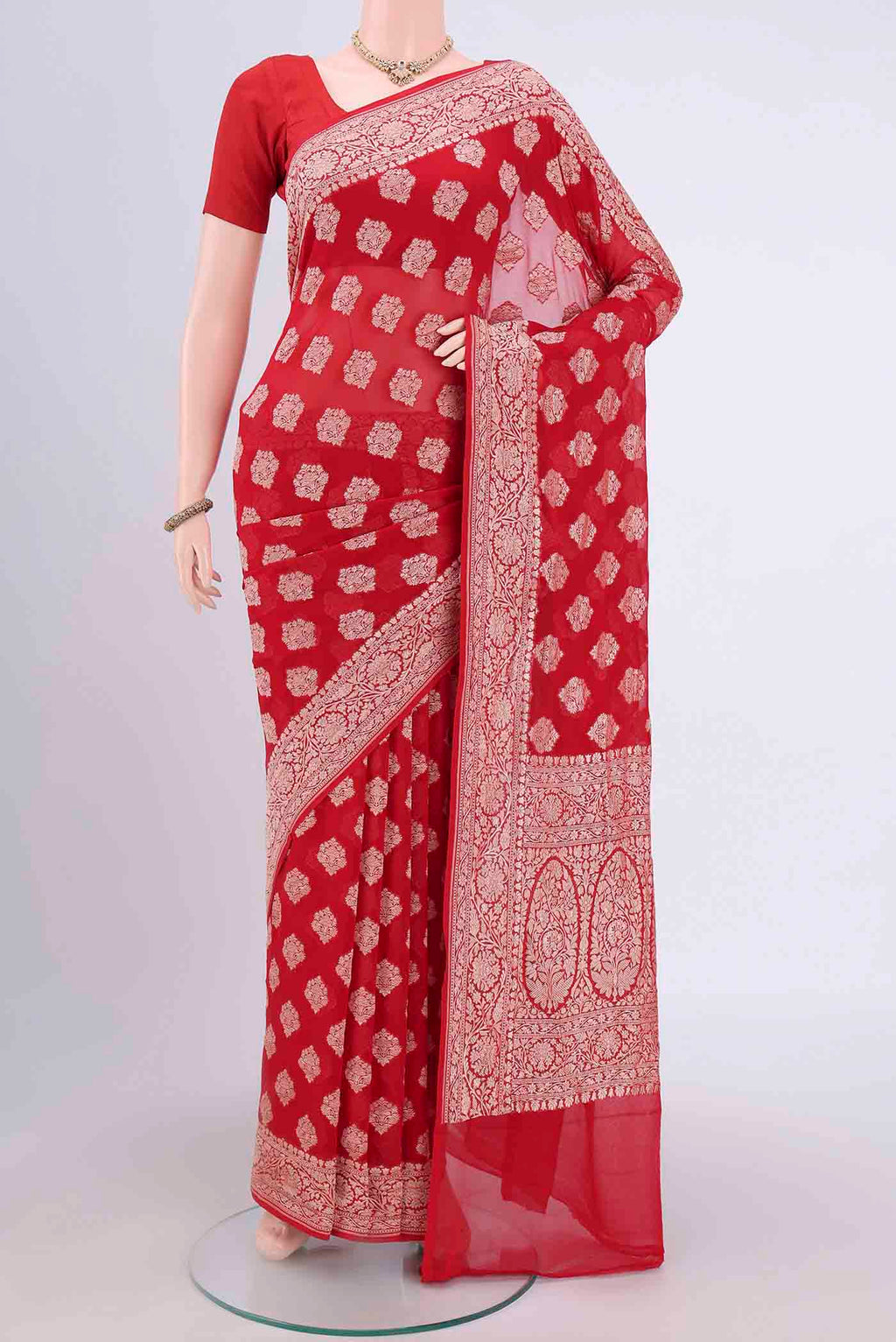 Red Banarasi Georgette Saree with Zari Brocade on the body and Zari Border.  displayed on a mannequin
