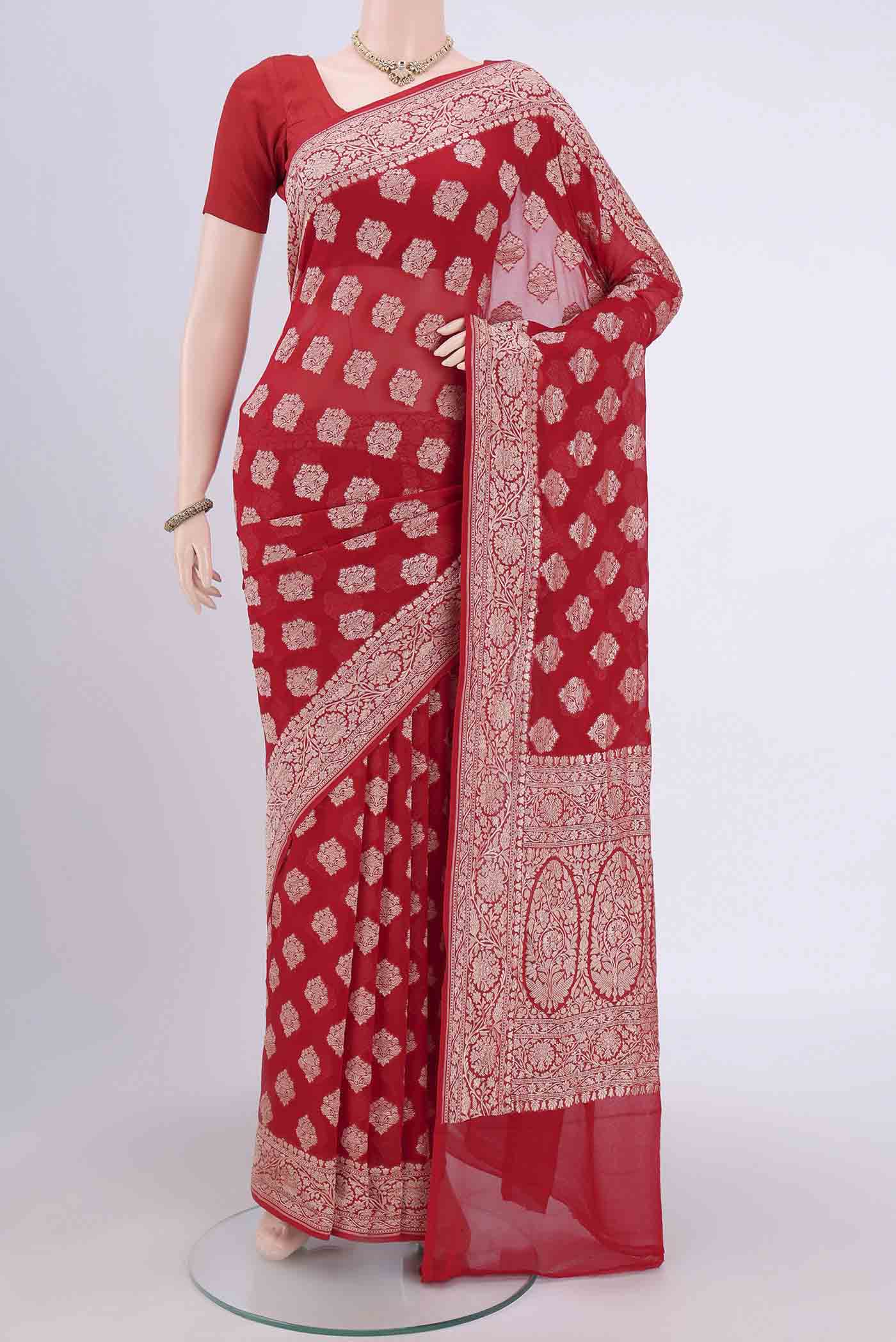 Red Banarasi Georgette Saree with Zari Brocade on the body and Zari Border.  displayed on a mannequin