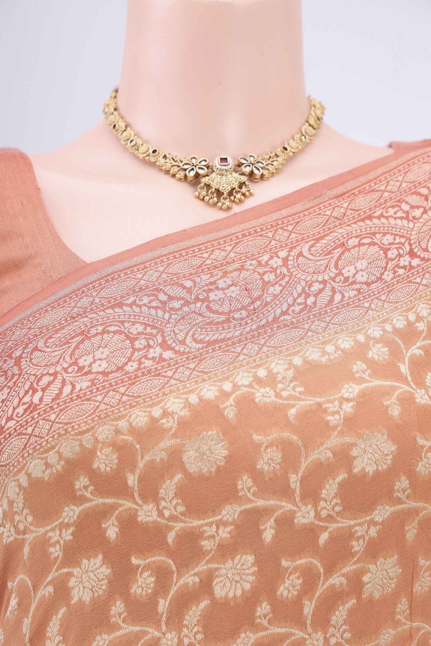 Border image of Peach Banarasi Georgette Saree with Zari Brocade on the body and Zari Border. 