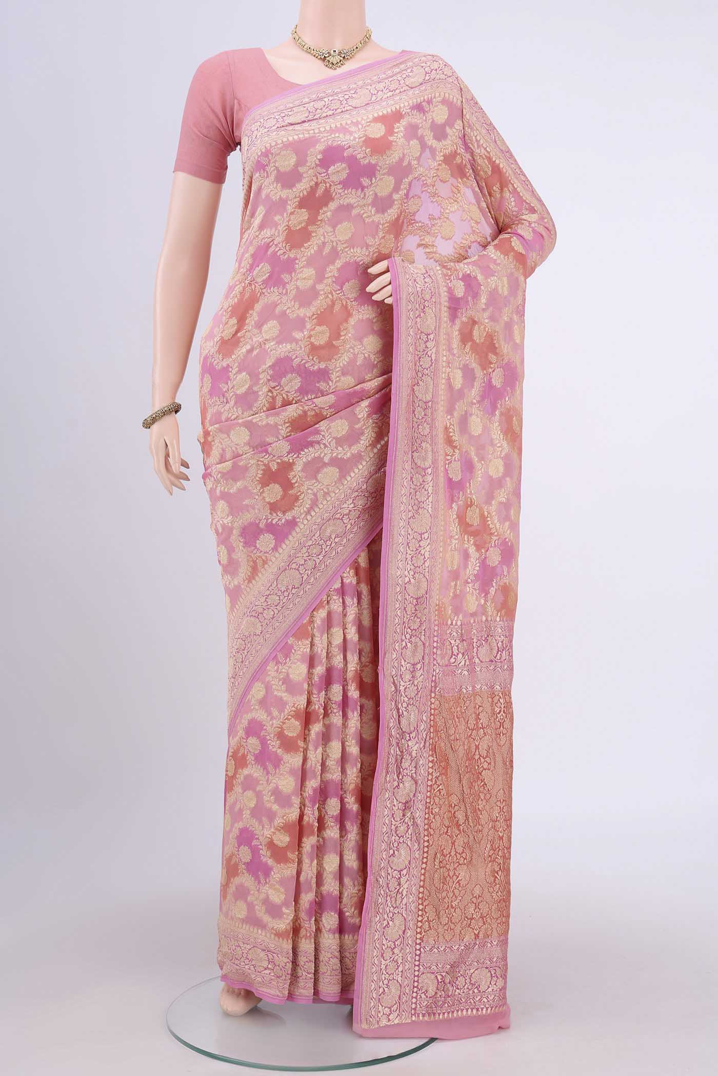 Pink Banarasi Georgette Saree with Zari Brocade on the body and Zari Border.  displayed on a mannequin
