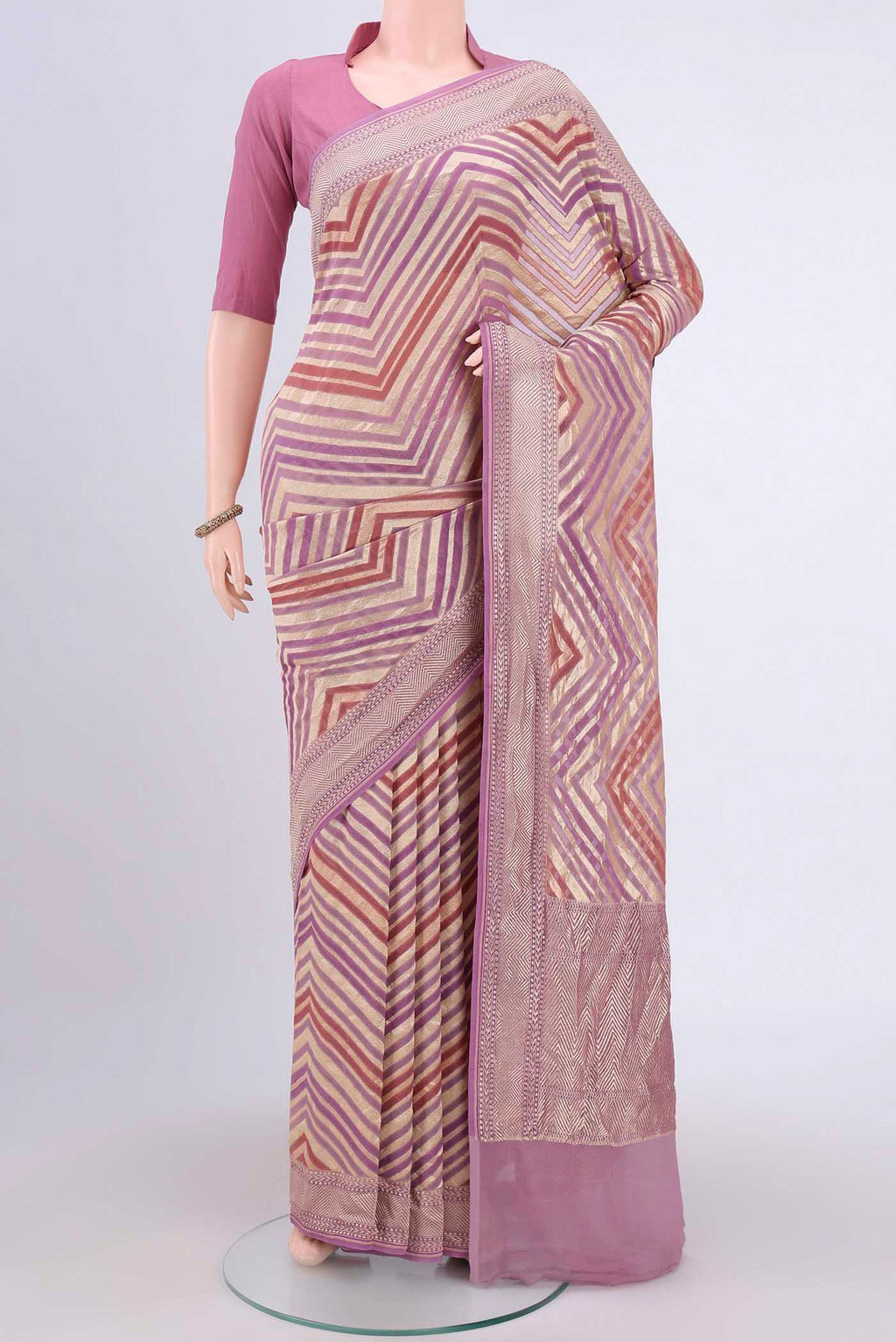 Mauve Banarasi Georgette Saree with Zari Brocade on the body and Zari Border.  displayed on a mannequin