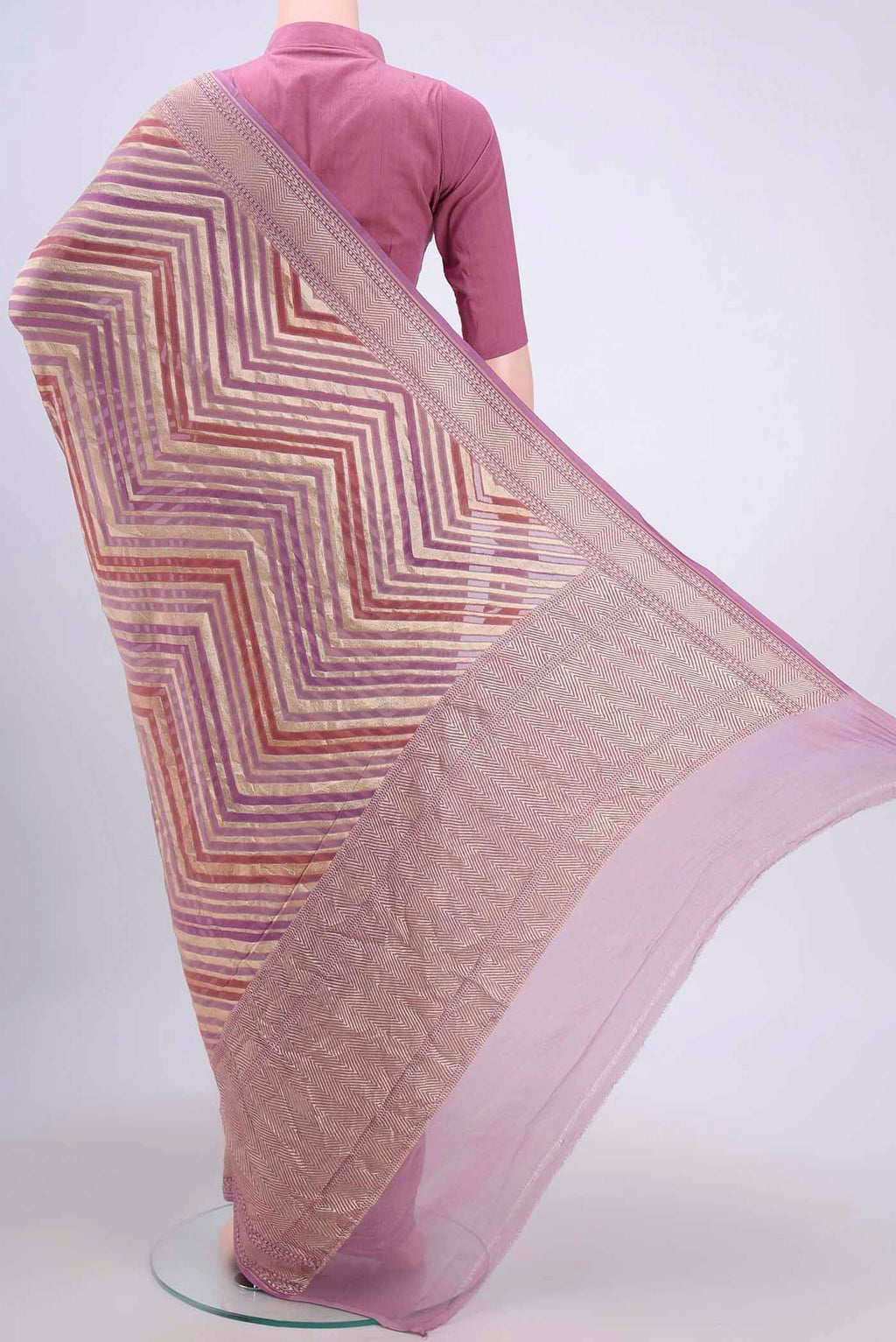 Flat view of Mauve Banarasi Georgette Saree with Zari Brocade on the body and Zari Border. 