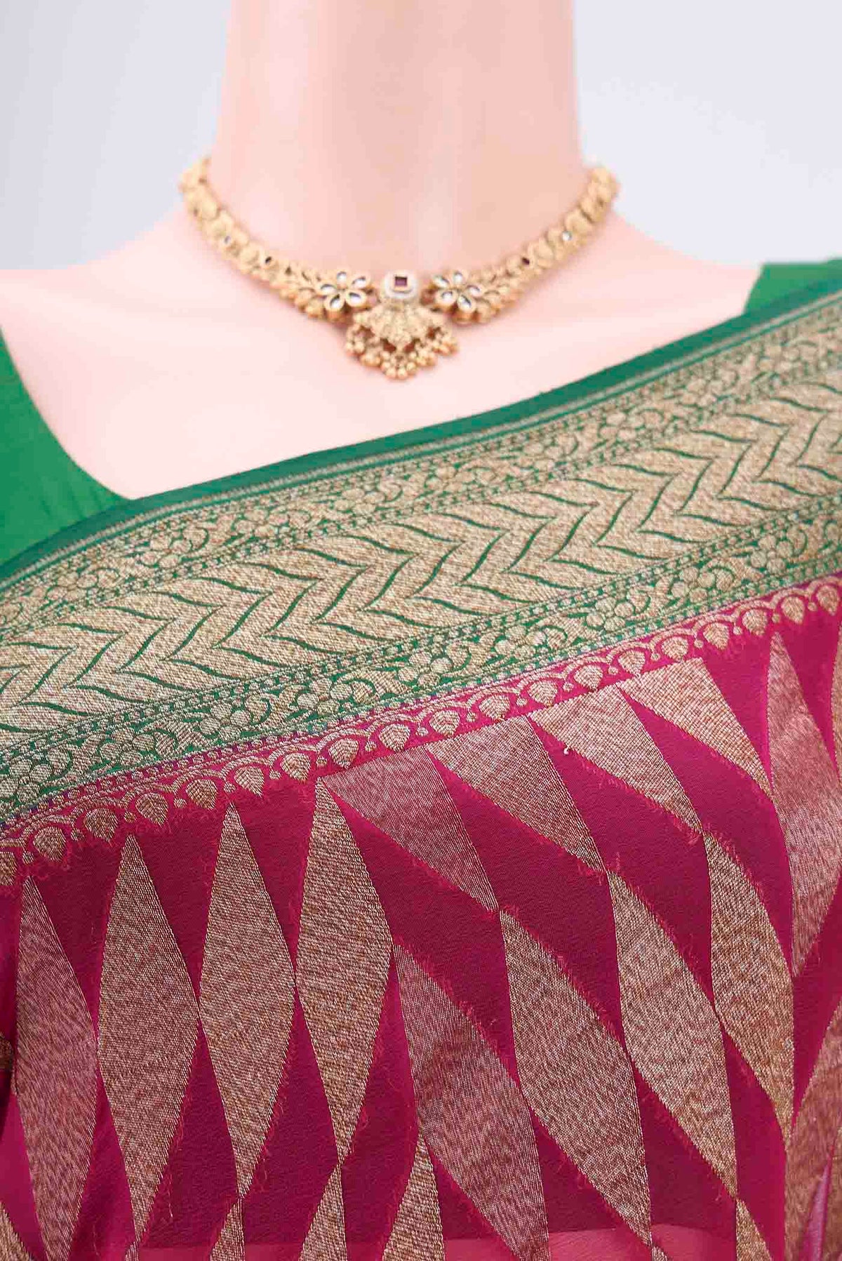 Border image of Rani Pink Banarasi Georgette Saree with Zari Brocade on the body and Zari Border. 