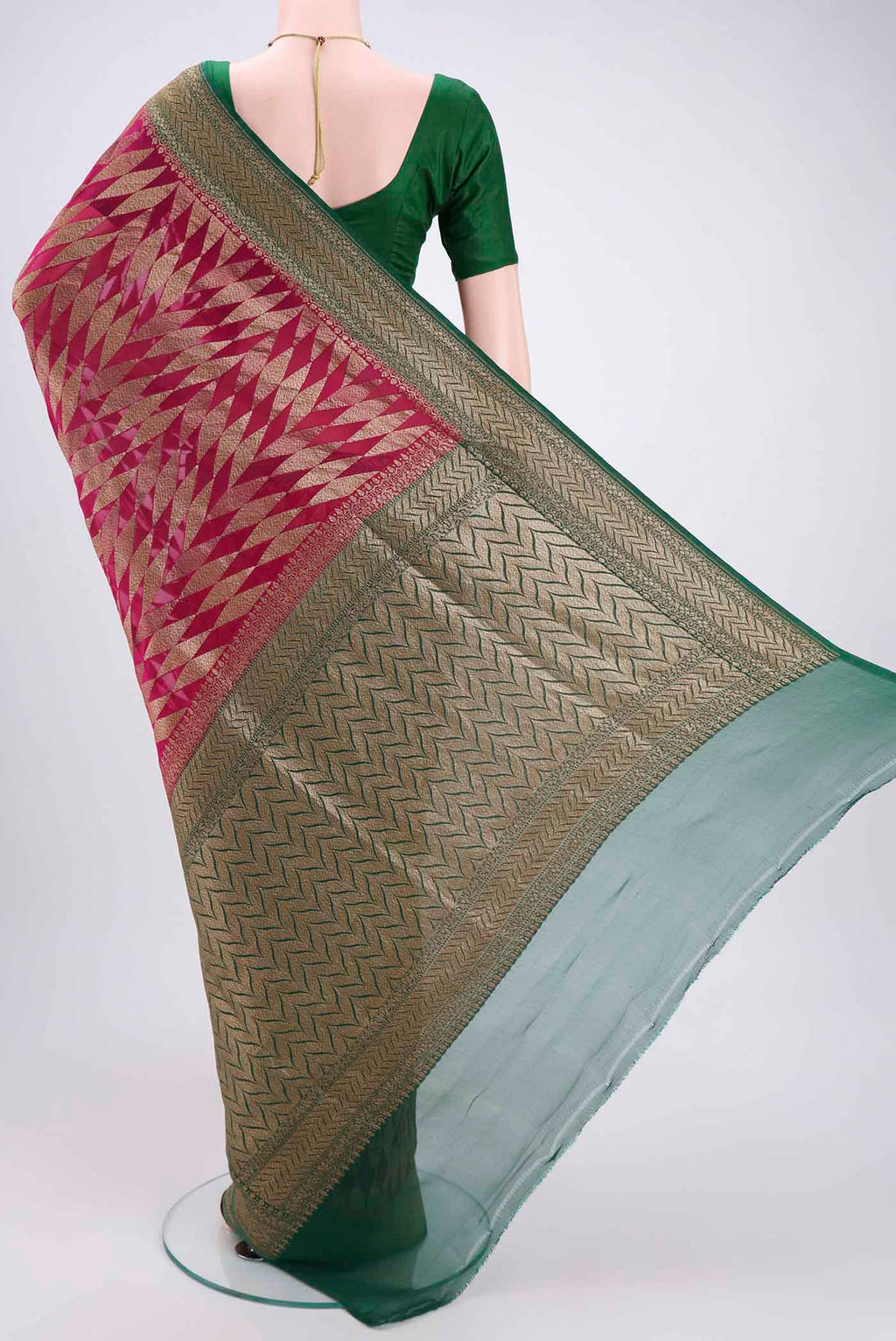 Flat view of Rani Pink Banarasi Georgette Saree with Zari Brocade on the body and Zari Border. 