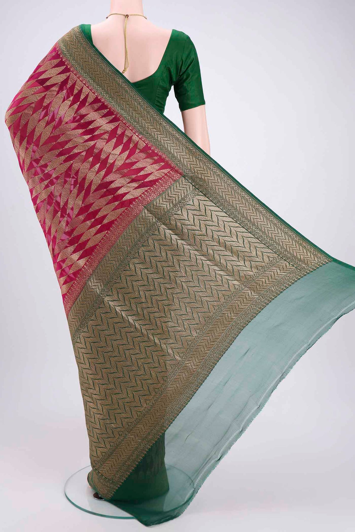 Flat view of Rani Pink Banarasi Georgette Saree with Zari Brocade on the body and Zari Border. 