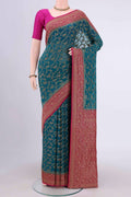Sea Green Banarasi Georgette Saree with Zari Brocade on the body and Zari Border.  displayed on a mannequin