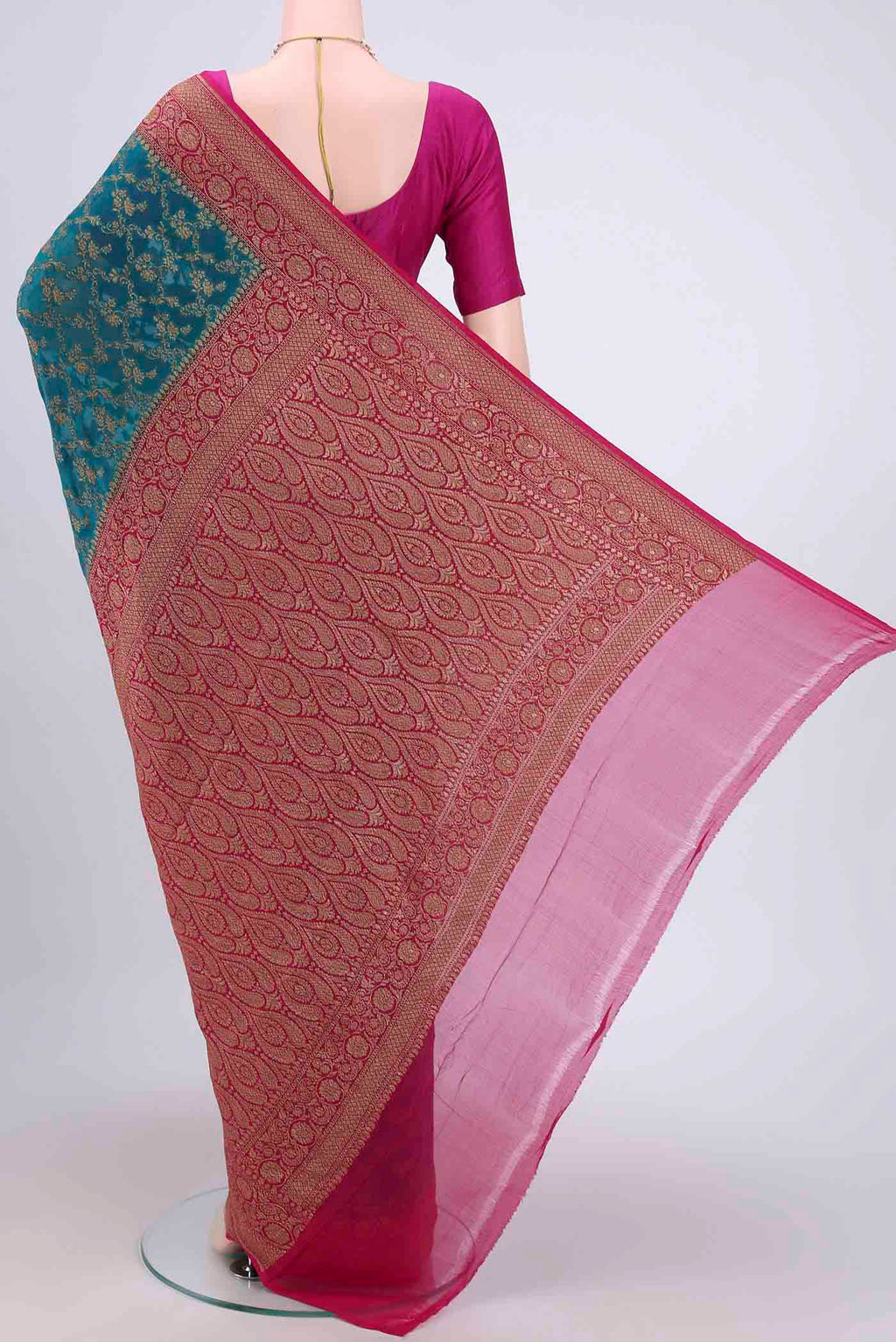 Flat view of Sea Green Banarasi Georgette Saree with Zari Brocade on the body and Zari Border. 