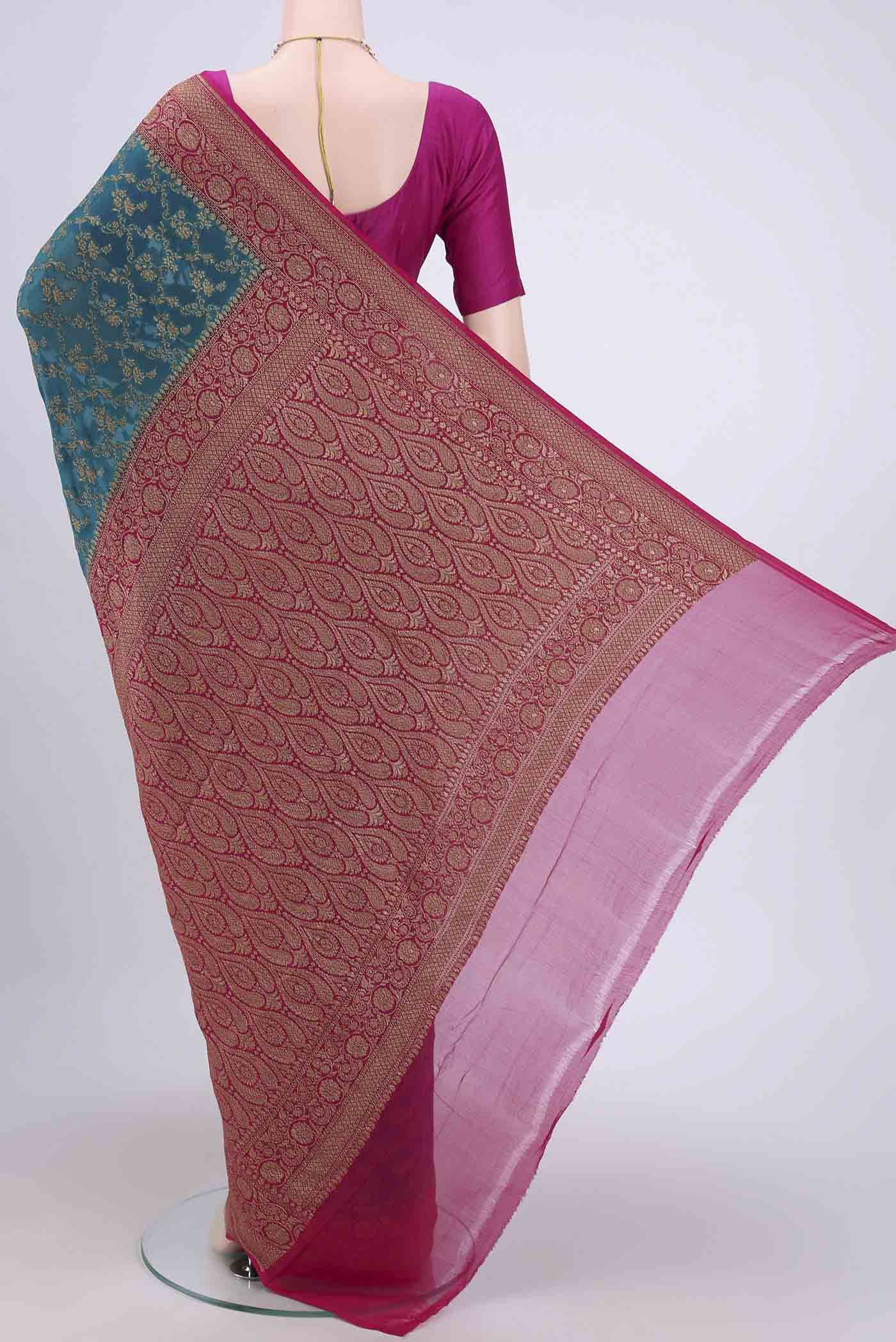 Flat view of Sea Green Banarasi Georgette Saree with Zari Brocade on the body and Zari Border. 