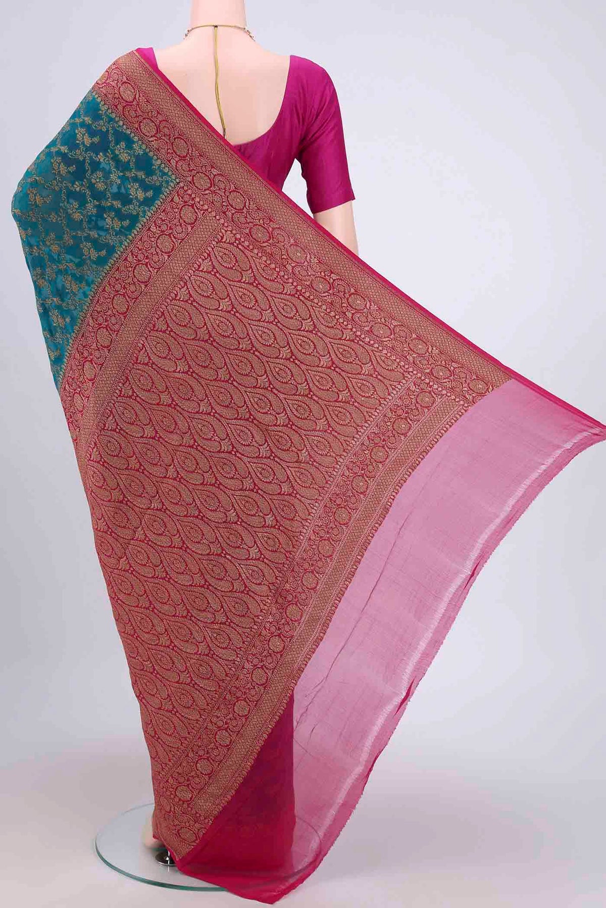 Flat view of Sea Green Banarasi Georgette Saree with Zari Brocade on the body and Zari Border. 