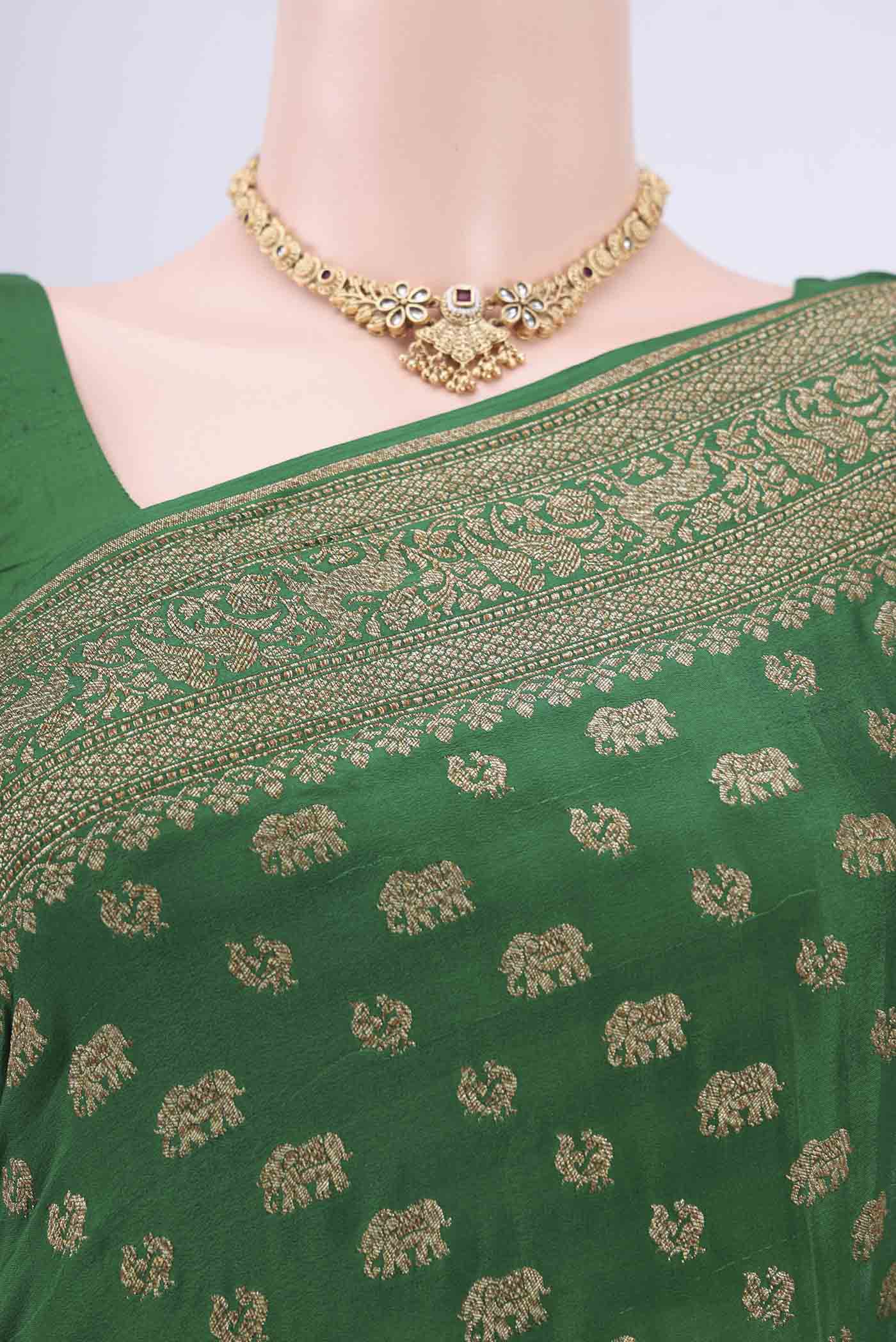Border image of Bottle Green Banarasi Georgette Saree with Zari Brocade on the body and Zari Border. 