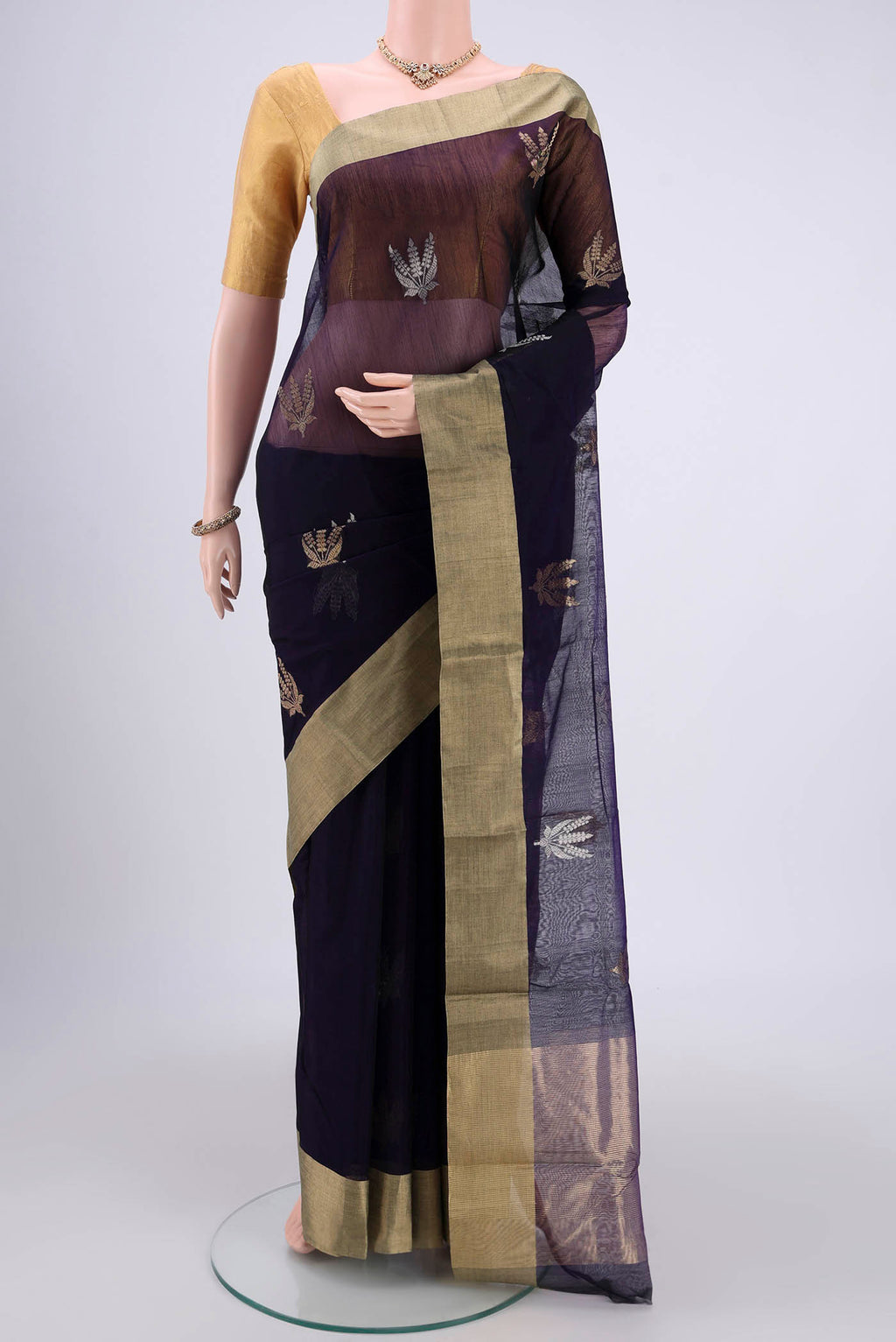 Navy Blue Chanderi Silk Cotton Saree with Zari Butta on the body and Zari Border.  displayed on a mannequin