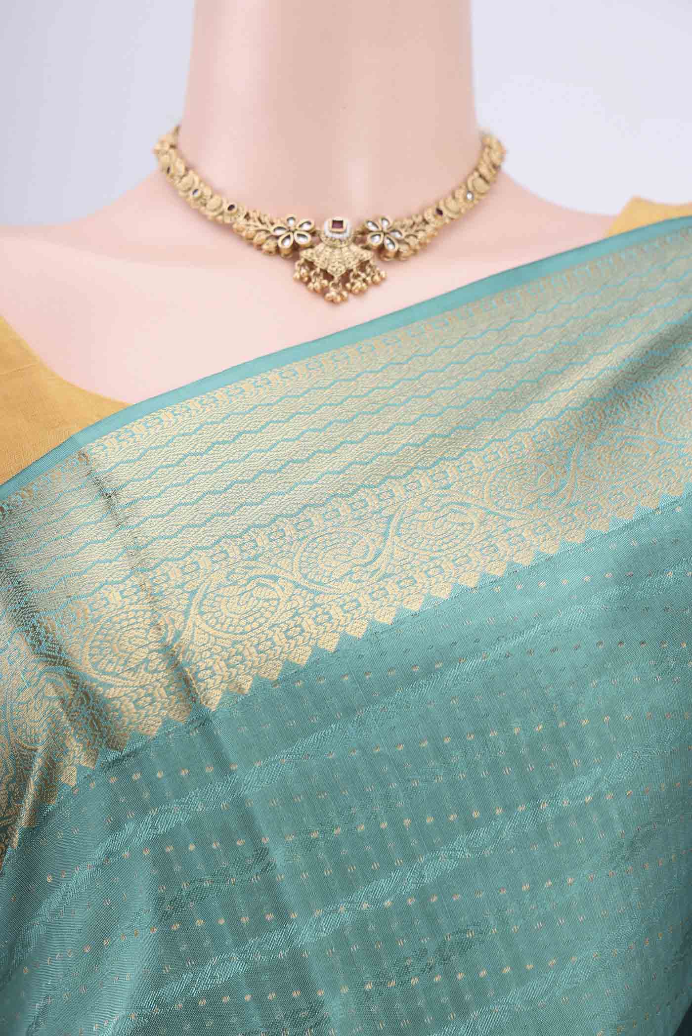 Border image of Sage Green Soft Silk Saree with Jacquard With Zari Butta on the body and Zari Border. 