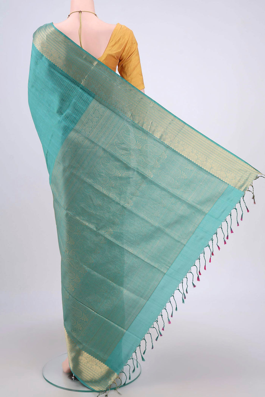 Flat view of Sage Green Soft Silk Saree with Jacquard With Zari Butta on the body and Zari Border. 