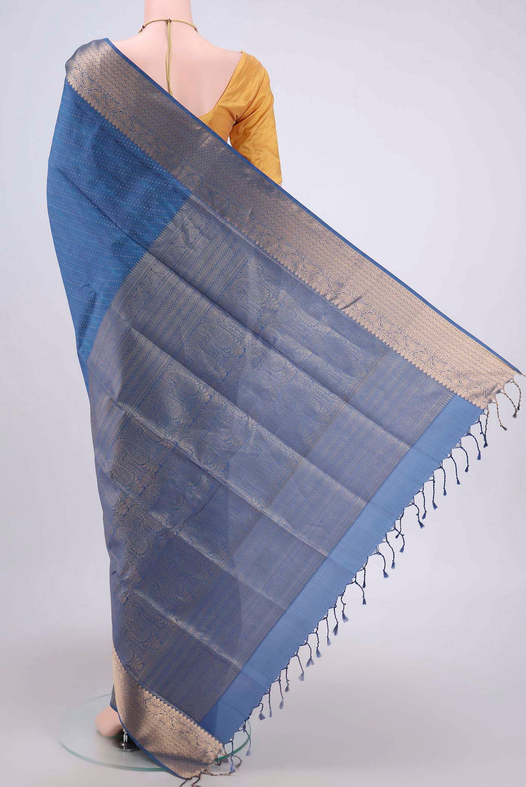 Flat view of Blue Soft Silk Saree with Jacquard With Zari Butta on the body and Zari Border. 