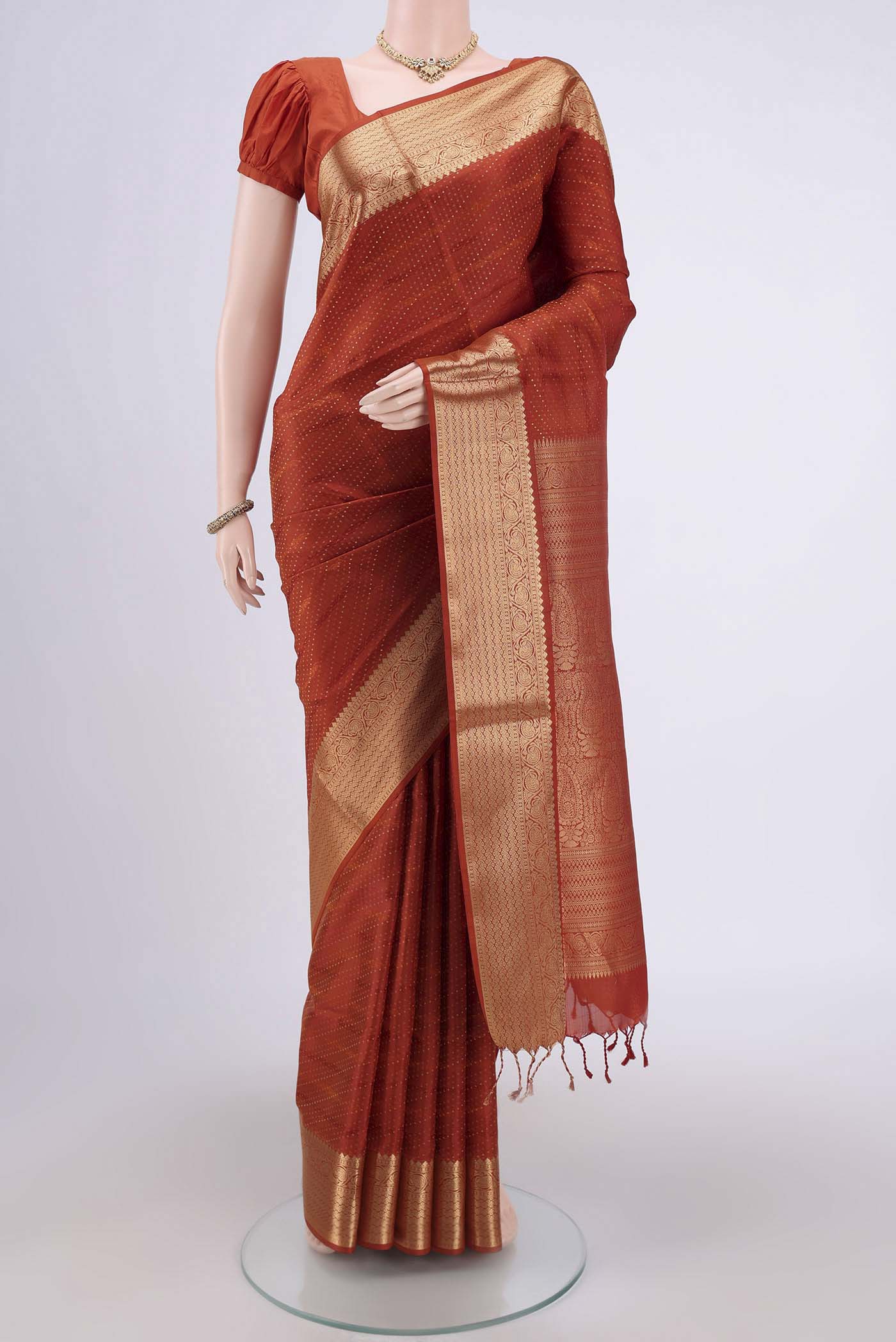 Mustard Soft Silk Saree with Jacquard With Zari Butta on the body and Zari Border.  displayed on a mannequin