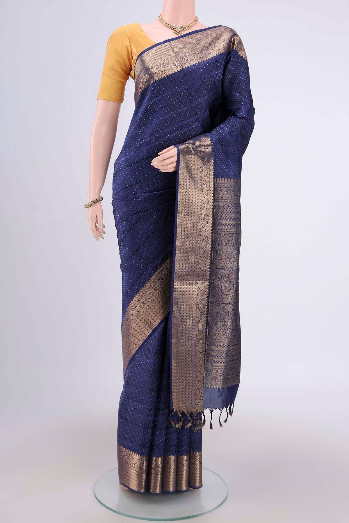 Navy Blue Soft Silk Saree with Jacquard With Zari Butta on the body and Zari Border.  displayed on a mannequin