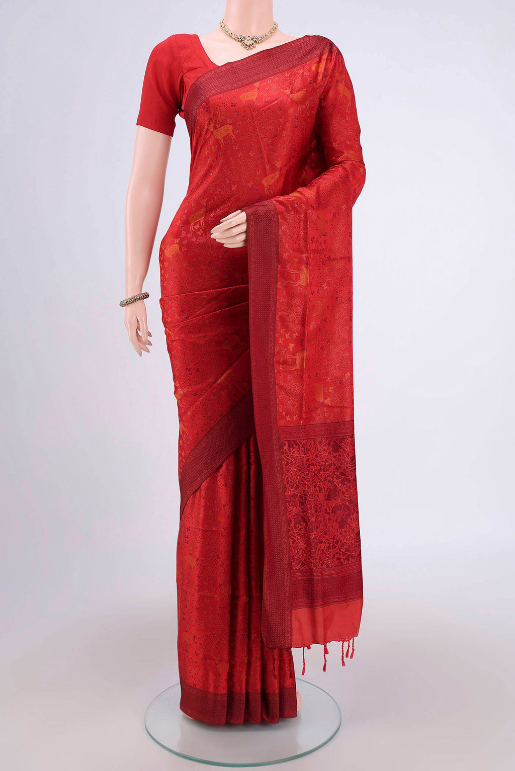 Red Soft Silk Saree with Jacquard design on the body and Thread Border.  displayed on a mannequin