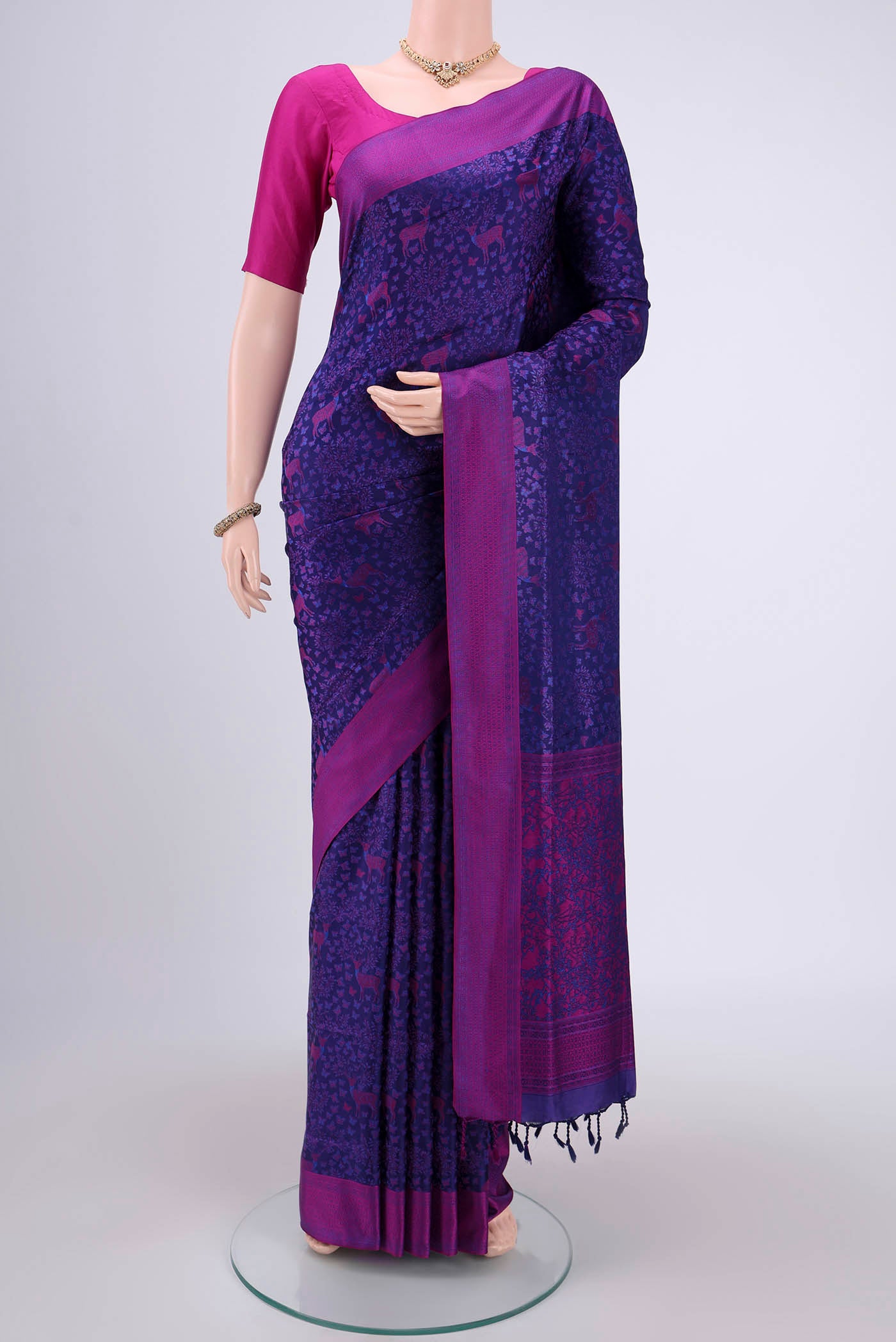 Purple Soft Silk Saree with Jacquard design on the body and Thread Border.  displayed on a mannequin