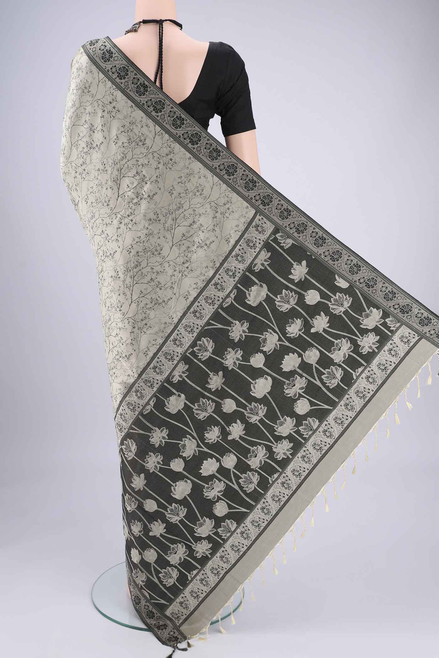 Flat view of Davys Grey Soft Silk Saree with Jacquard design on the body and Thread Border. 