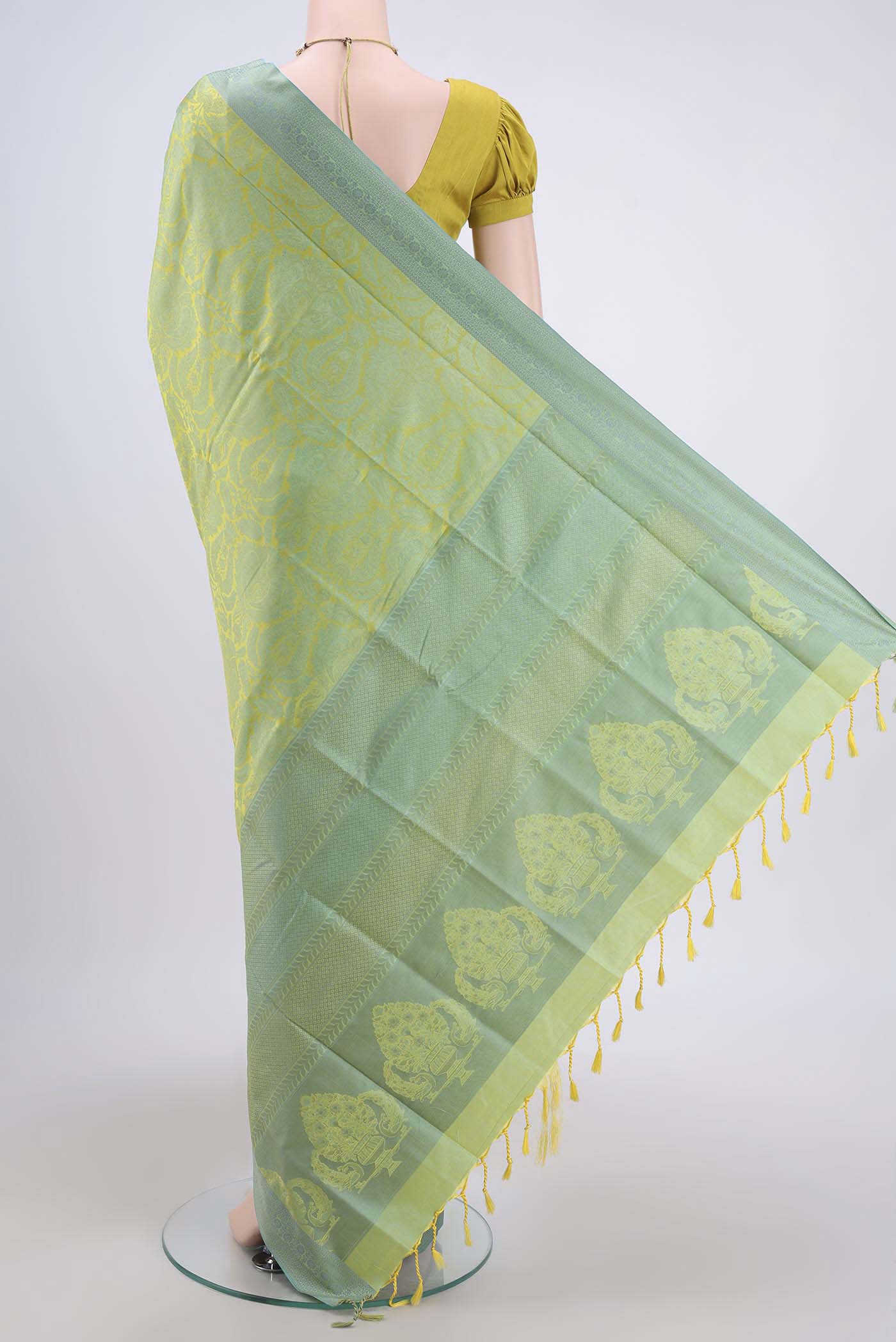 Flat view of Acid Green Soft Silk Saree with Jacquard design on the body and Thread Border. 
