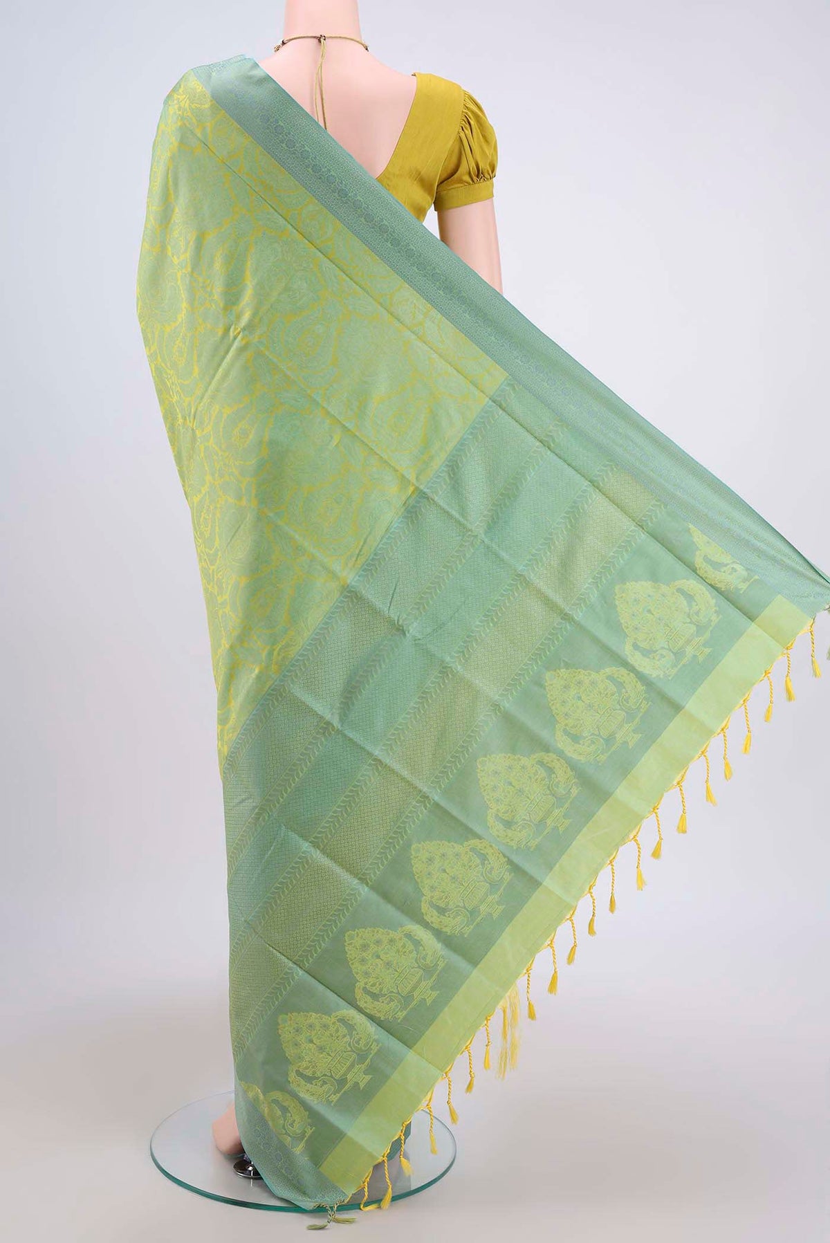 Flat view of Acid Green Soft Silk Saree with Jacquard design on the body and Thread Border. 