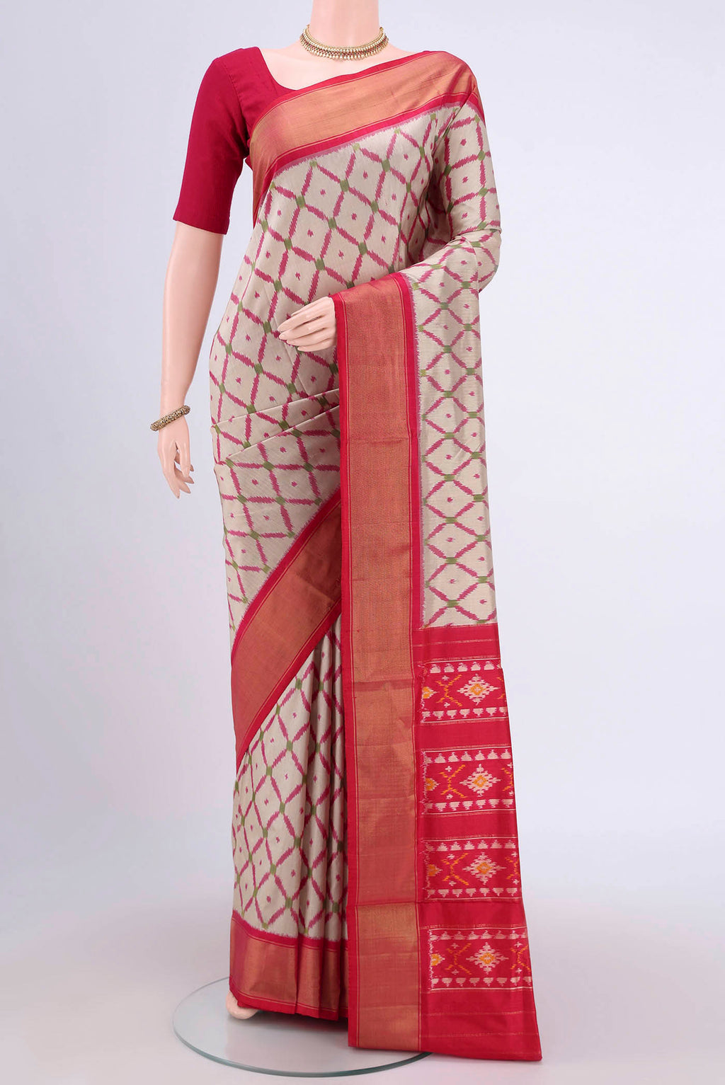 Beige Pochampally Silk Saree with Pure Ikat on the body and Zari Border.  displayed on a mannequin