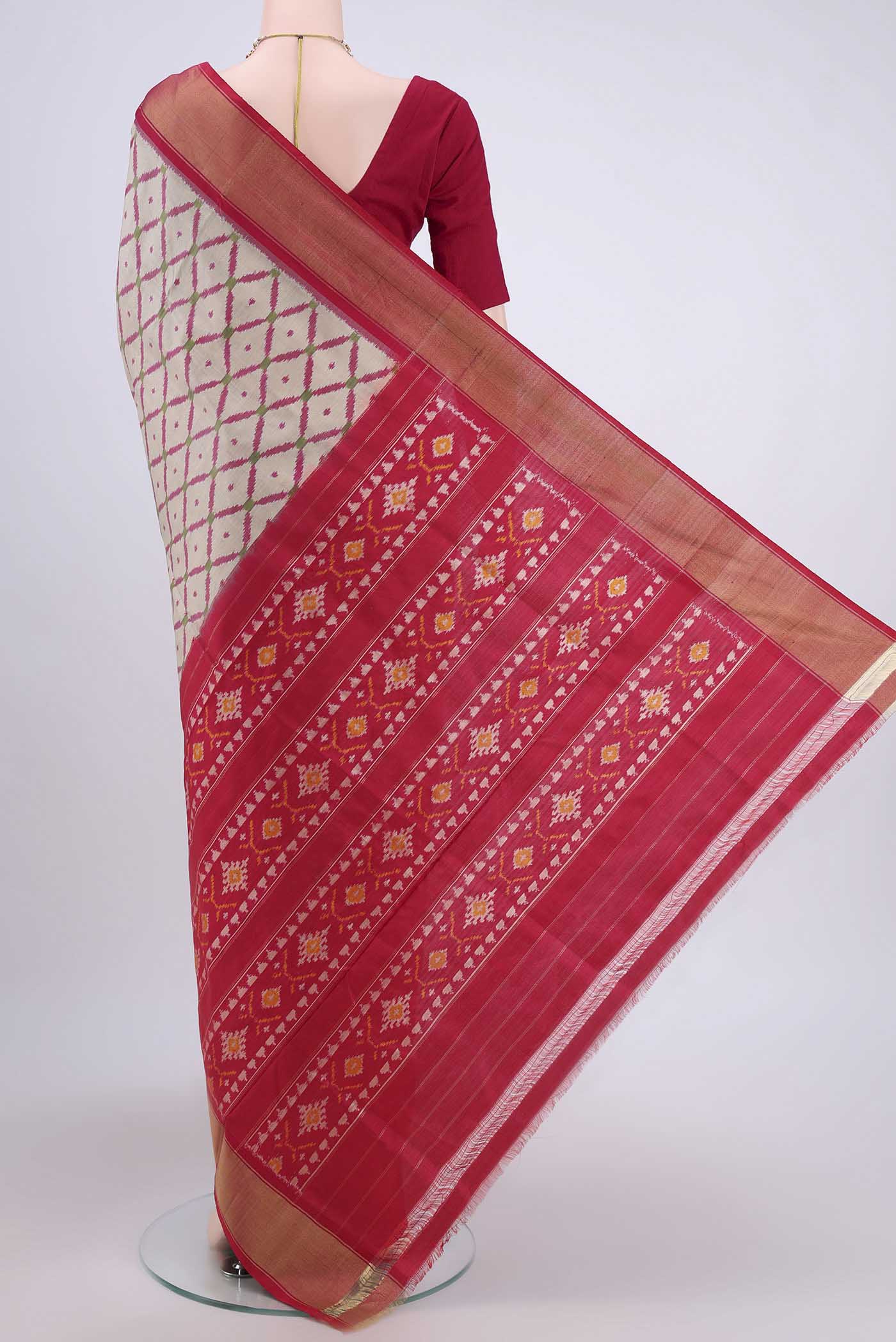 Flat view of Beige Pochampally Silk Saree with Pure Ikat on the body and Zari Border. 