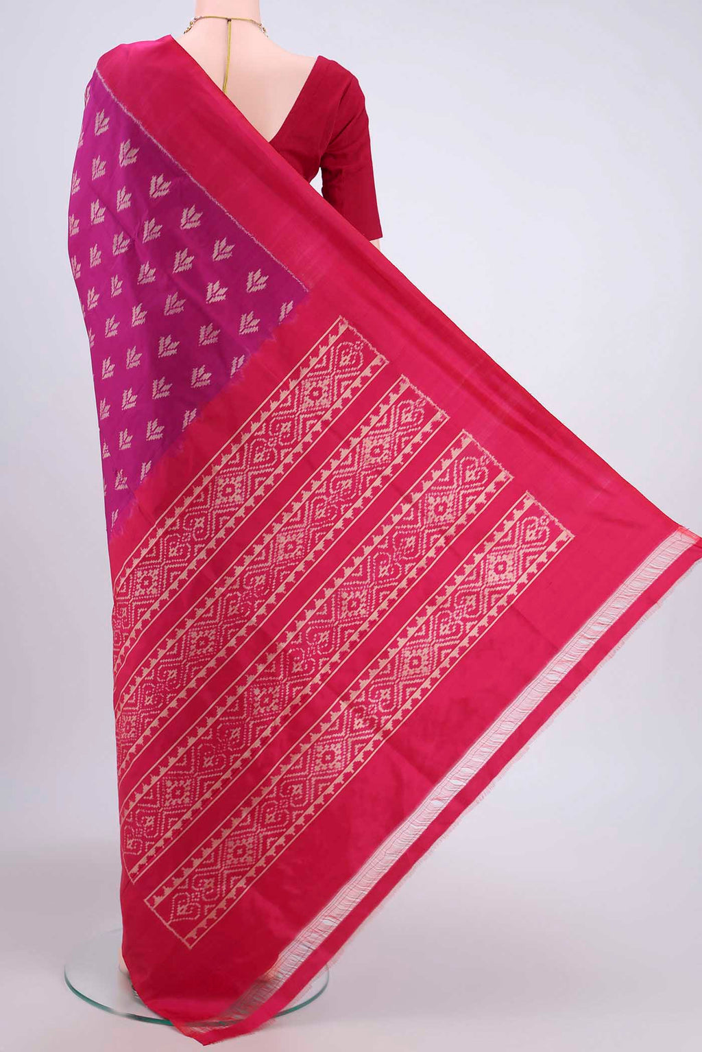 Flat view of Magenta Pochampally Silk Saree with Pure Ikat on the body and Plain Border. 