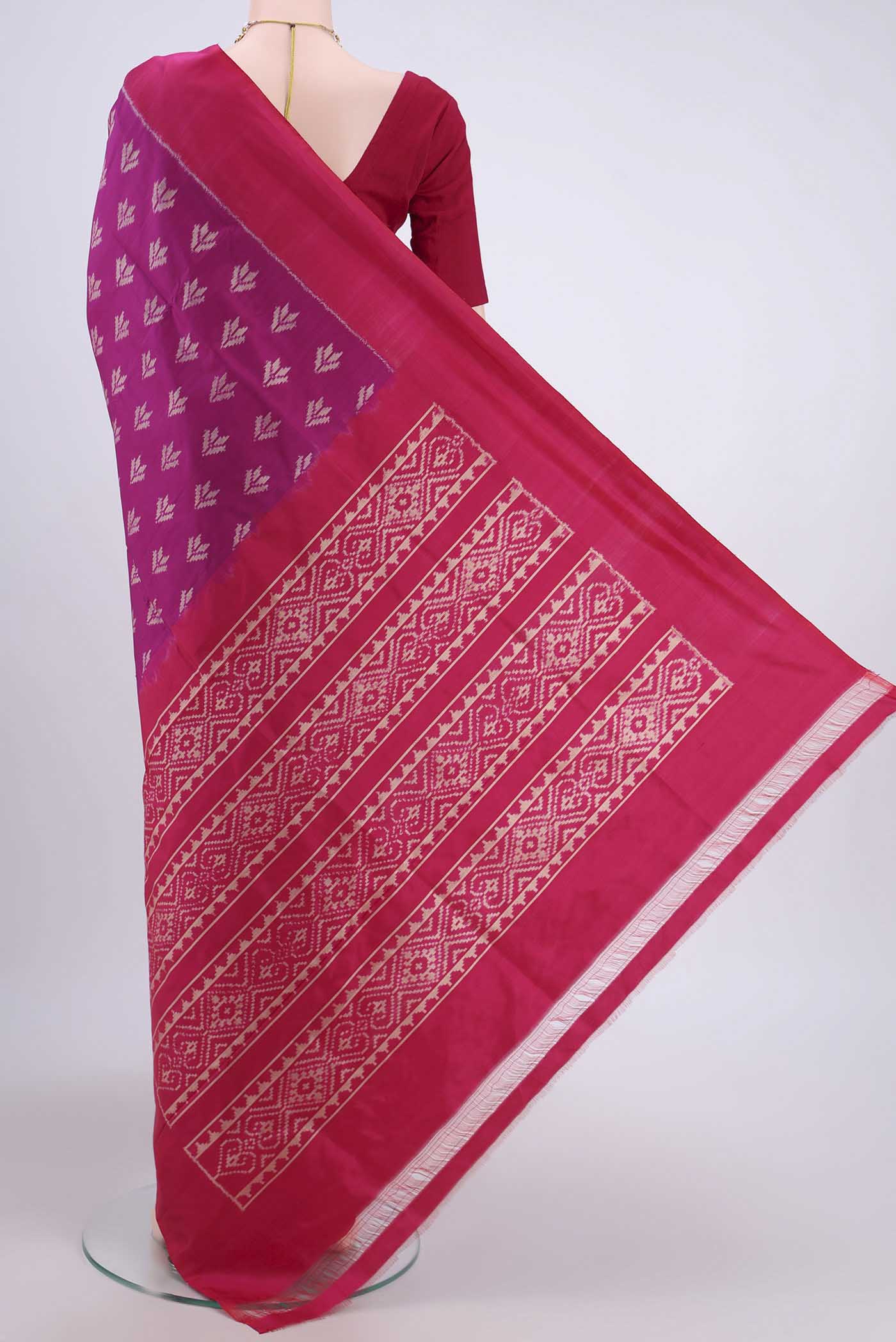 Flat view of Magenta Pochampally Silk Saree with Pure Ikat on the body and Plain Border. 