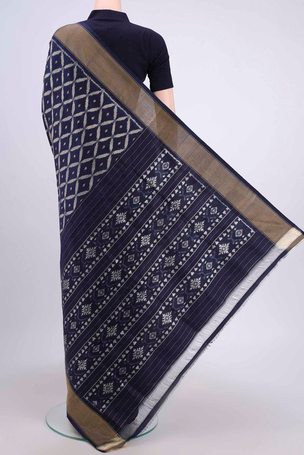 Flat view of Brown Pochampally Silk Saree with Pure Ikat on the body and Zari Border. 