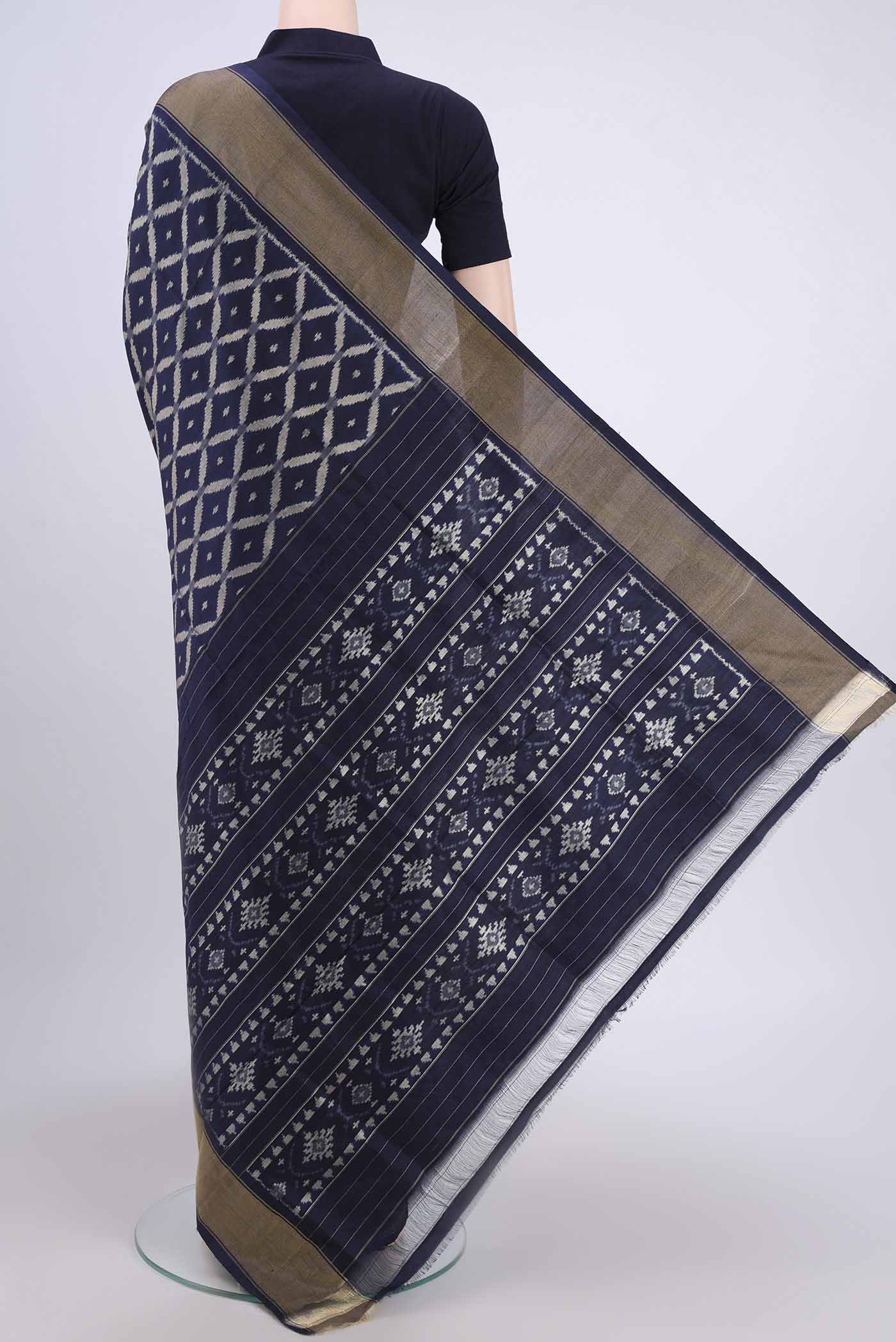 Flat view of Brown Pochampally Silk Saree with Pure Ikat on the body and Zari Border. 