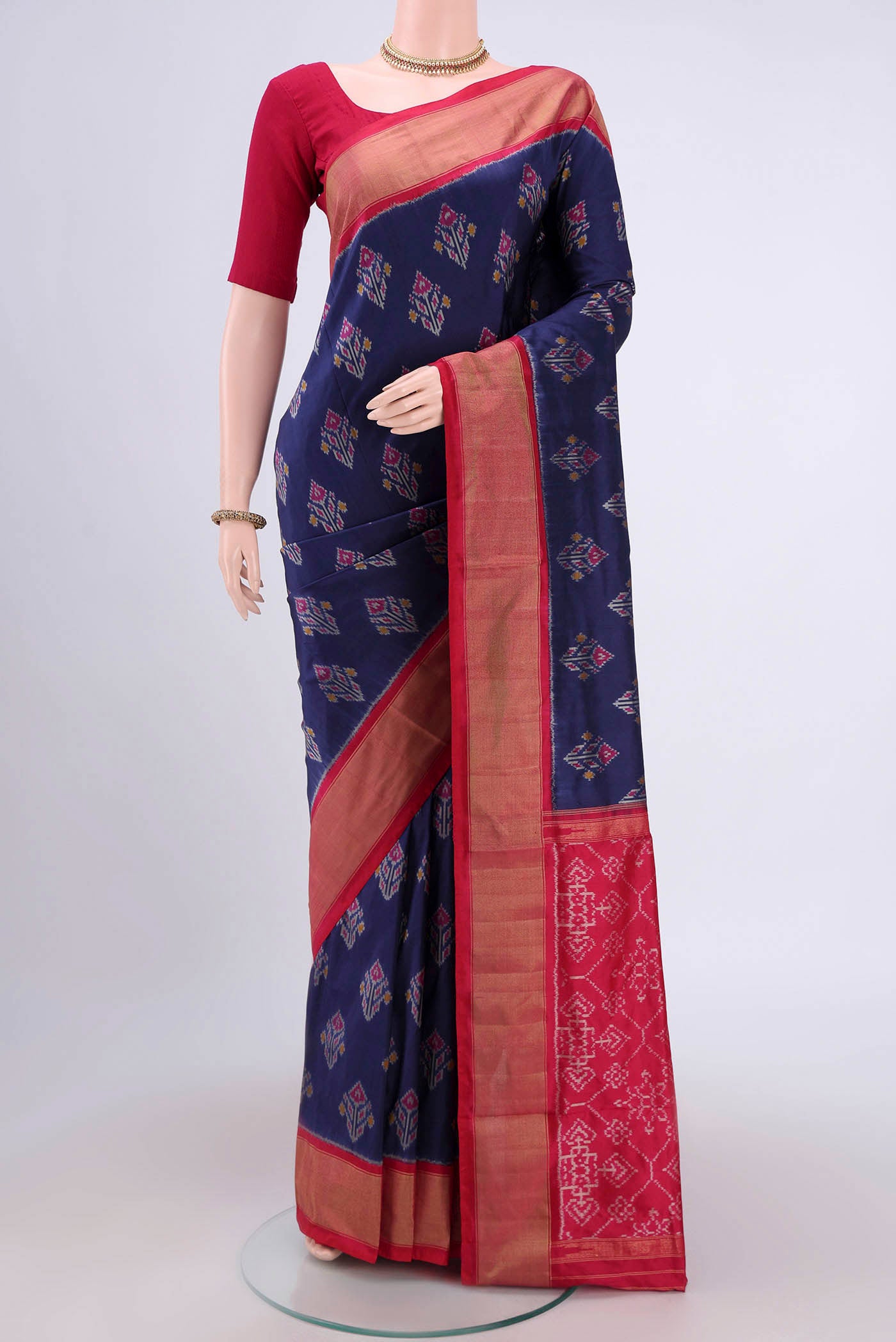 Navy Blue Pochampally Silk Saree with Pure Ikat on the body and Zari Border.  displayed on a mannequin