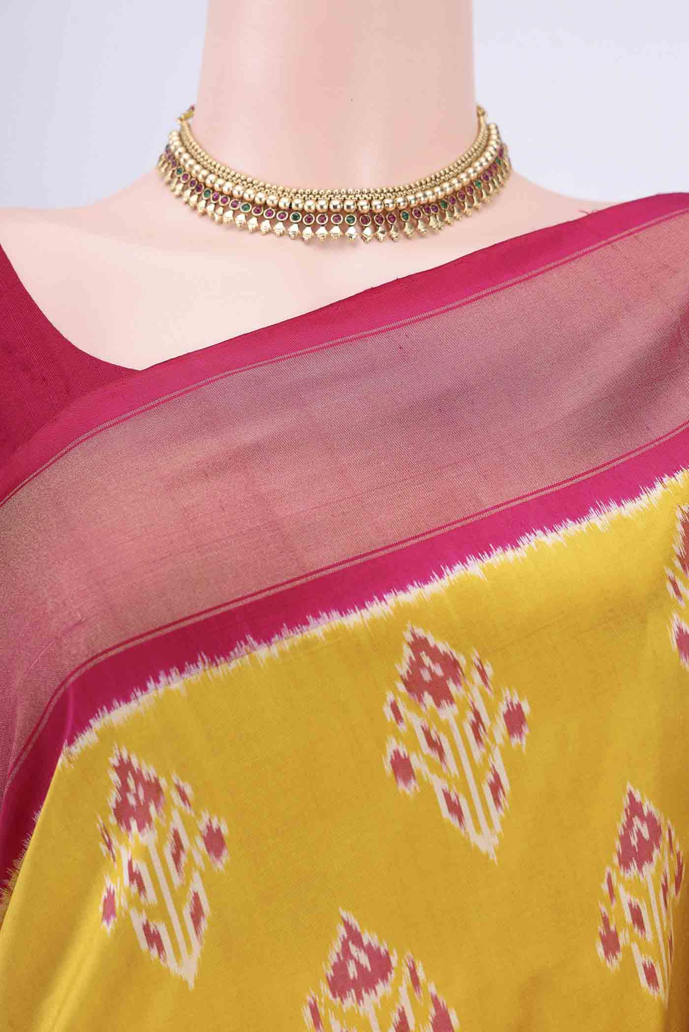 Border image of Mustard Pochampally Silk Saree with Pure Ikat on the body and Zari Border. 
