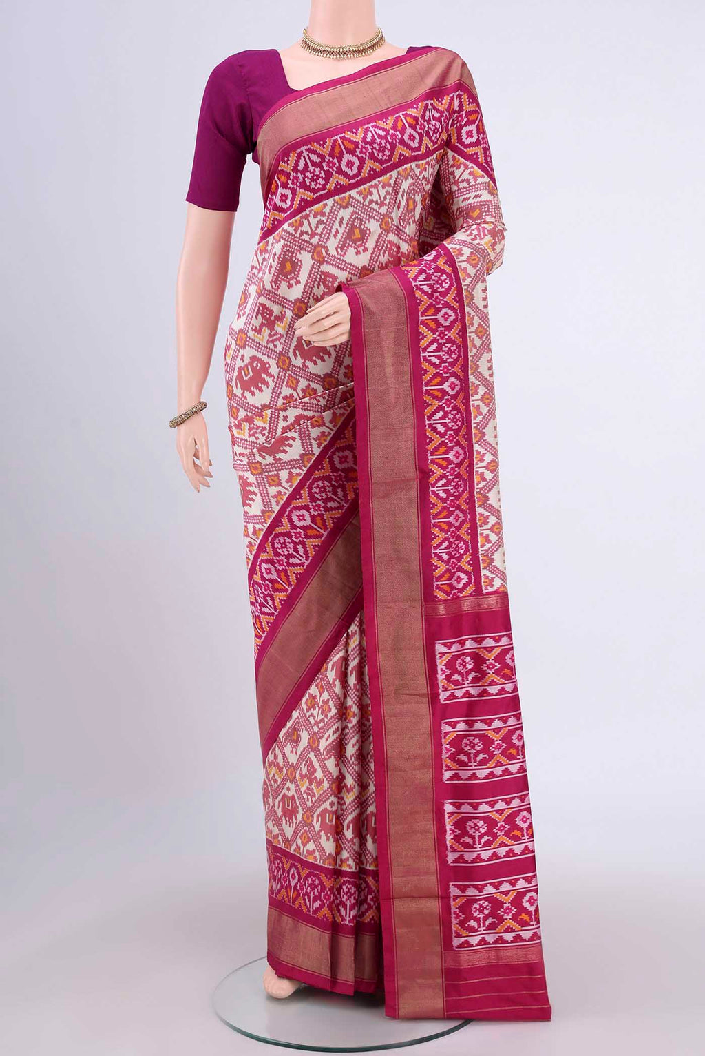 Off White Pochampally Silk Saree with Pure Ikat on the body and Zari Border.  displayed on a mannequin
